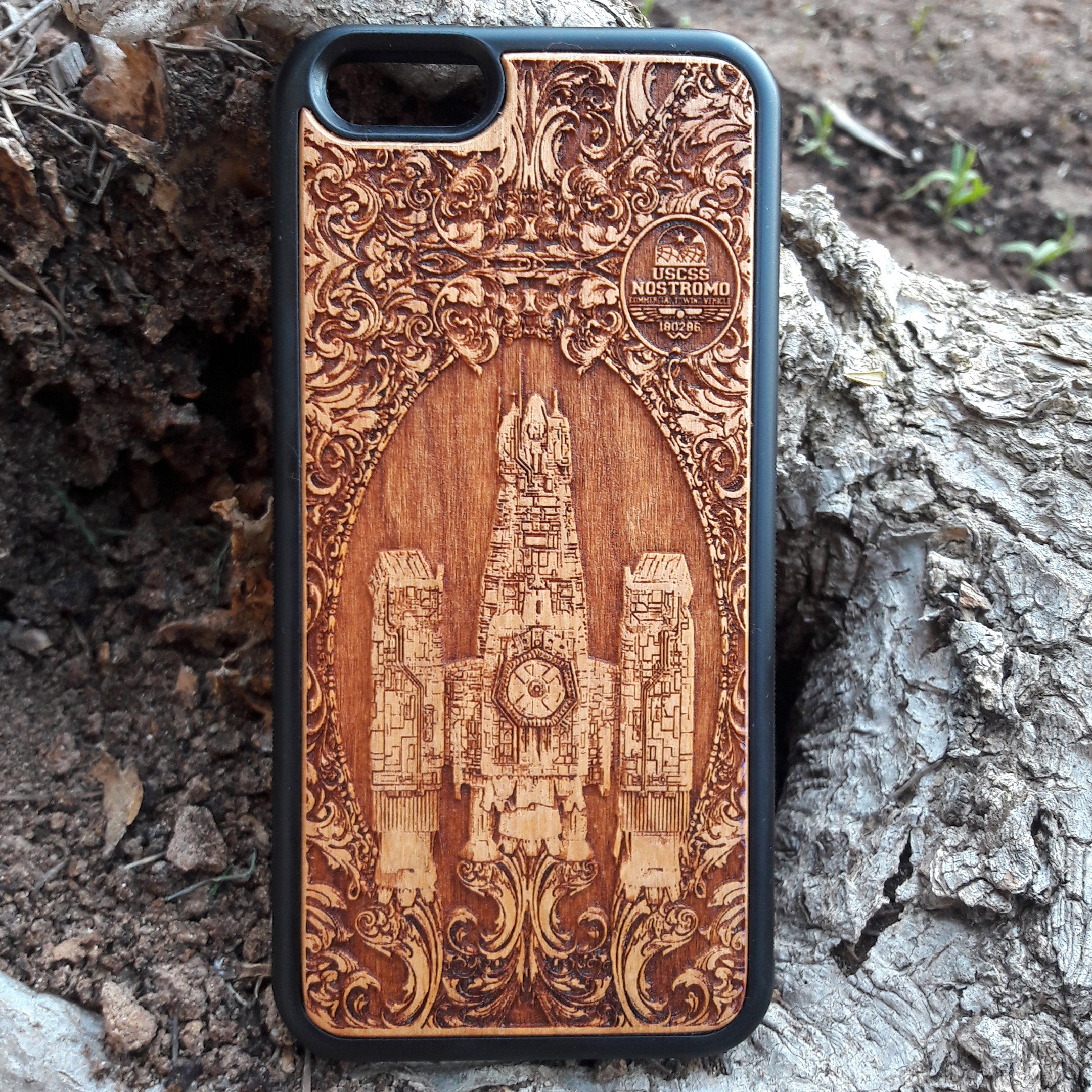 Wooden phone case with detailed Nostromo ship design from the Alien movie, engraved for iPhone , Samsung Galaxy S, and other models. Perfect for sci-fi and Alien franchise fans, offering protection and style.