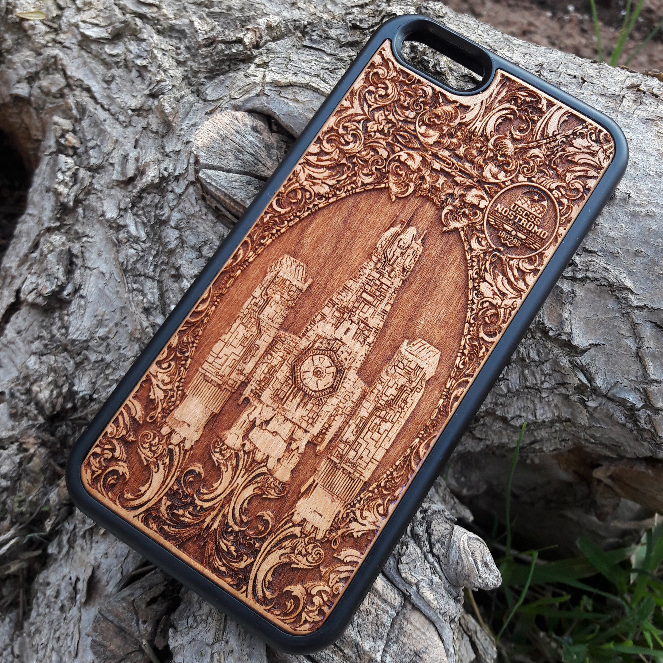 Wooden phone case with detailed Nostromo ship design from the Alien movie, engraved for iPhone , Samsung Galaxy S, and other models. Perfect for sci-fi and Alien franchise fans, offering protection and style.