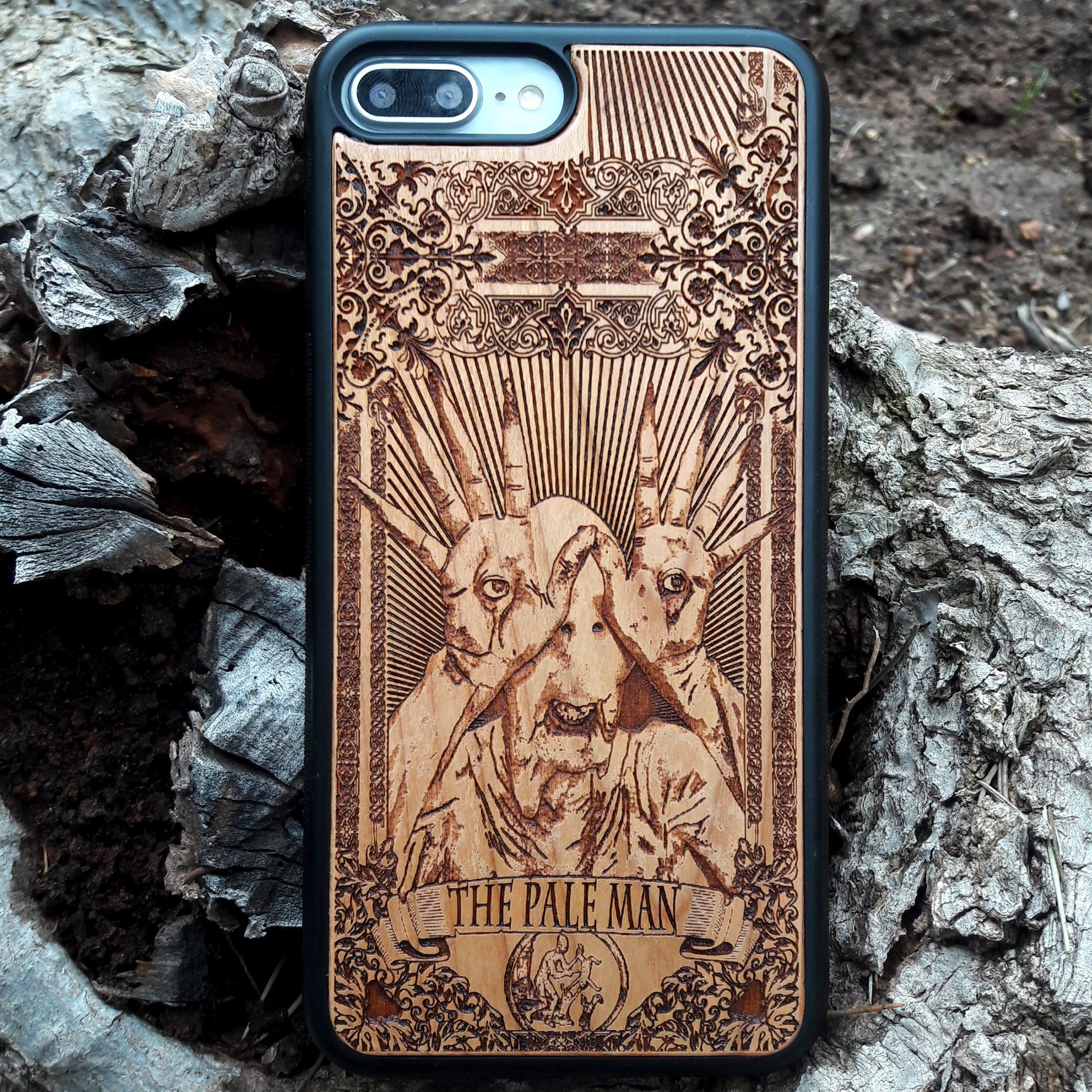 Wooden phone case with Pale Man design from Pan's Labyrinth, intricately engraved for iPhone , Galaxy S, and more. Gothic horror design offering premium protection.