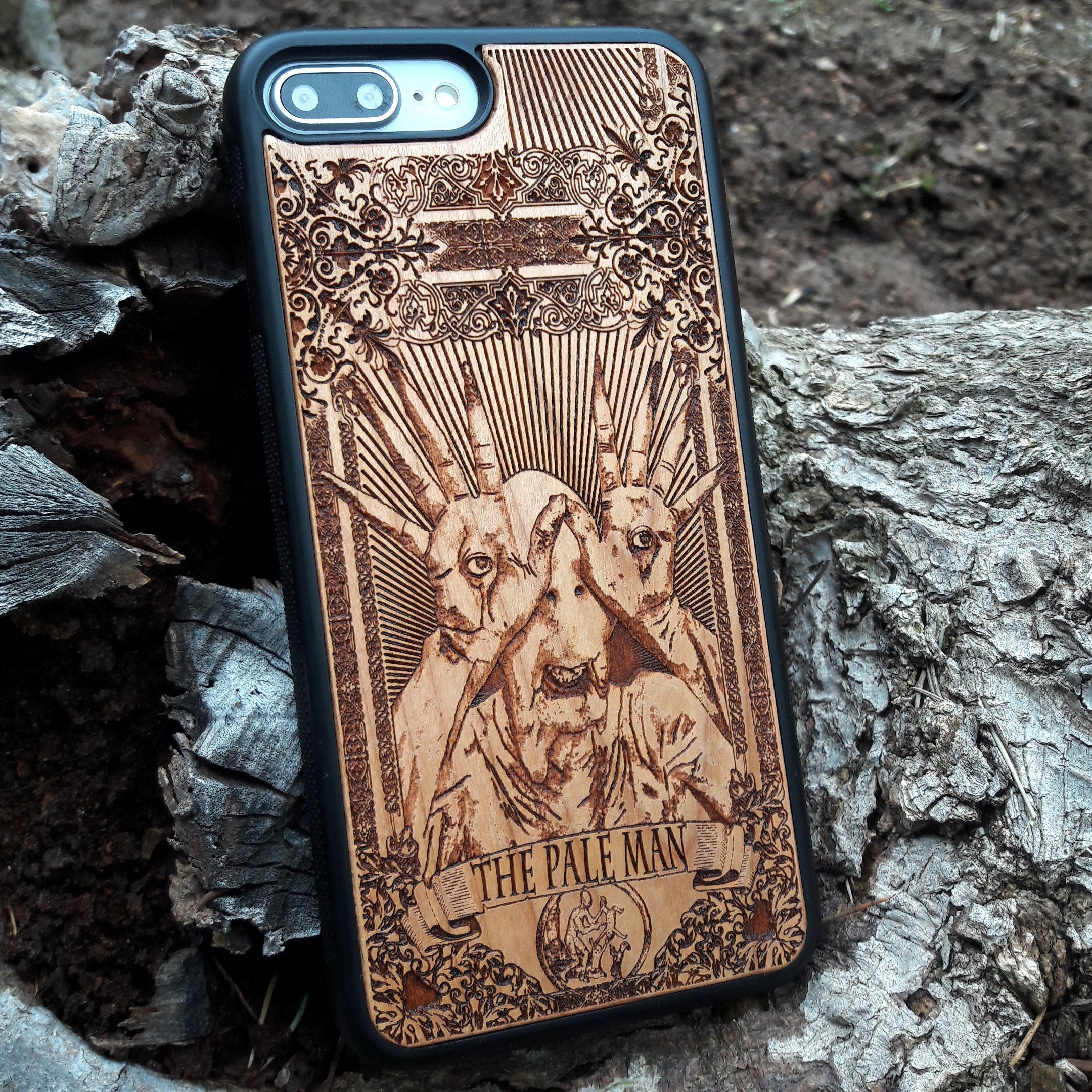 Wooden phone case with Pale Man design from Pan's Labyrinth, intricately engraved for iPhone , Galaxy S, and more. Gothic horror design offering premium protection.