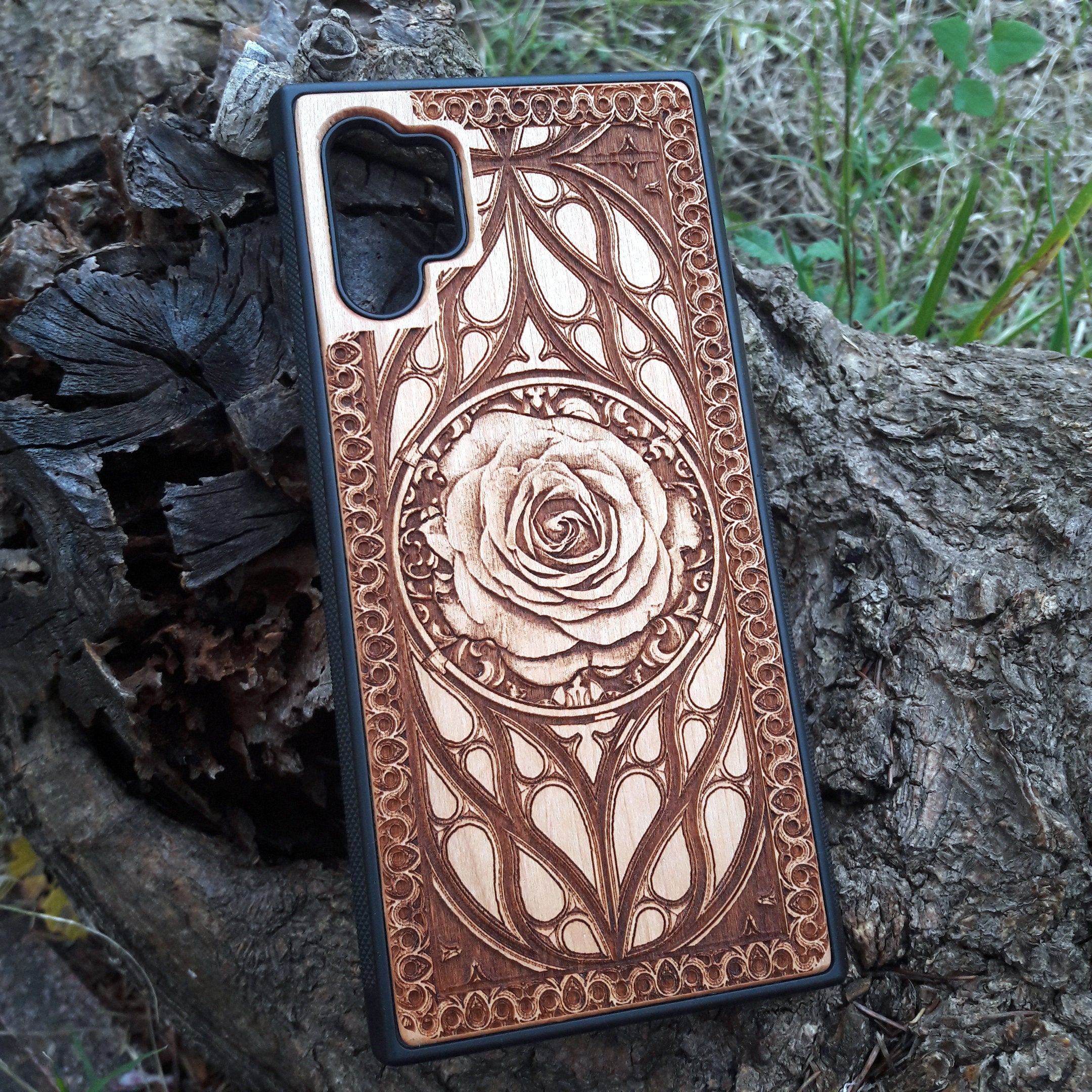 Laser-engraved wooden phone case with intricate rose design, slim, durable, and compatible with iPhone , iPhone 15, iPhone 14, iPhone 13, iPhone 12, iPhone 11, iPhone  Pro Max, iPhone  Mini, Samsung Galaxy S, Samsung Galaxy S24, Samsung Galaxy S23, Samsung Galaxy S22, Samsung Galaxy S21, Samsung Galaxy S20 Ultra, Samsung Galaxy S20 Plus, and Samsung Galaxy Note 20. Nature-inspired and unique!