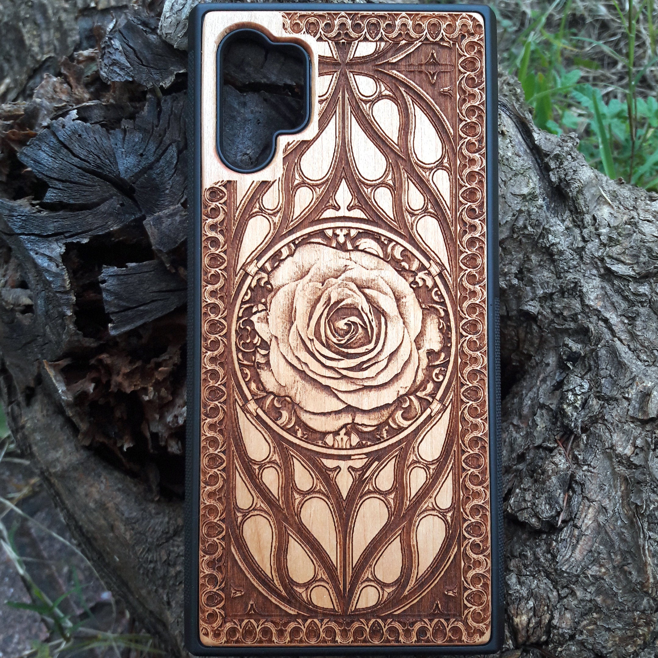 Laser-engraved wooden phone case with intricate rose design, slim, durable, and compatible with iPhone , iPhone 15, iPhone 14, iPhone 13, iPhone 12, iPhone 11, iPhone  Pro Max, iPhone  Mini, Samsung Galaxy S, Samsung Galaxy S24, Samsung Galaxy S23, Samsung Galaxy S22, Samsung Galaxy S21, Samsung Galaxy S20 Ultra, Samsung Galaxy S20 Plus, and Samsung Galaxy Note 20. Nature-inspired and unique!