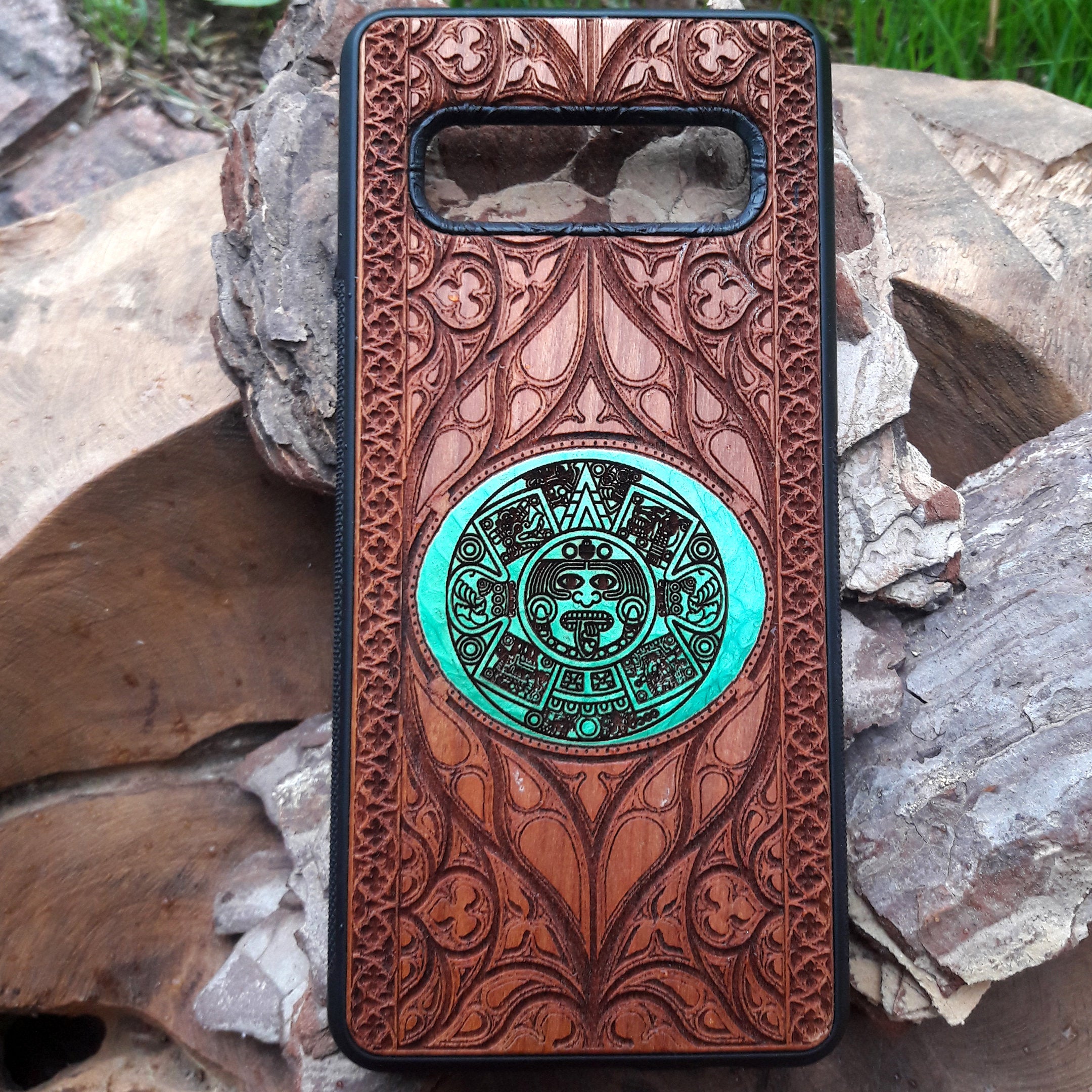 Wooden phone case featuring a detailed laser-engraved design of the Eye of Sauron from Lord of the Rings. The intricate engraving showcases the dark and iconic symbol surrounded by Elvish script. Compatible with iPhone , 15, 14, 13, 12, 11 Pro Max Mini and Samsung Galaxy S, S24, S23, S22, S21, S20 Ultra, Plus, Note 20. A unique and durable accessory for Tolkien fans seeking a striking and protective phone case.