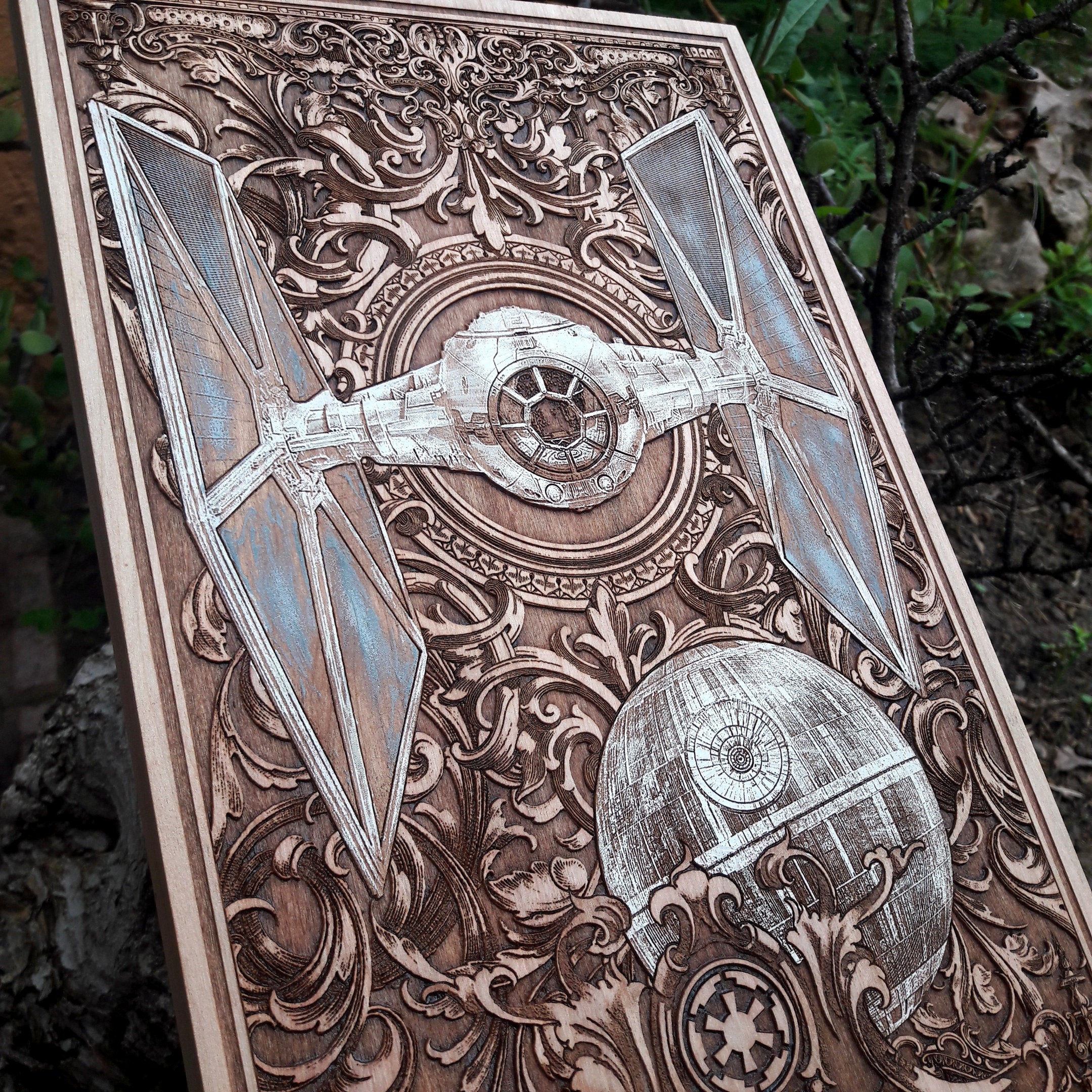 Handcrafted wooden art of a Star Wars Tie Fighter battle scene