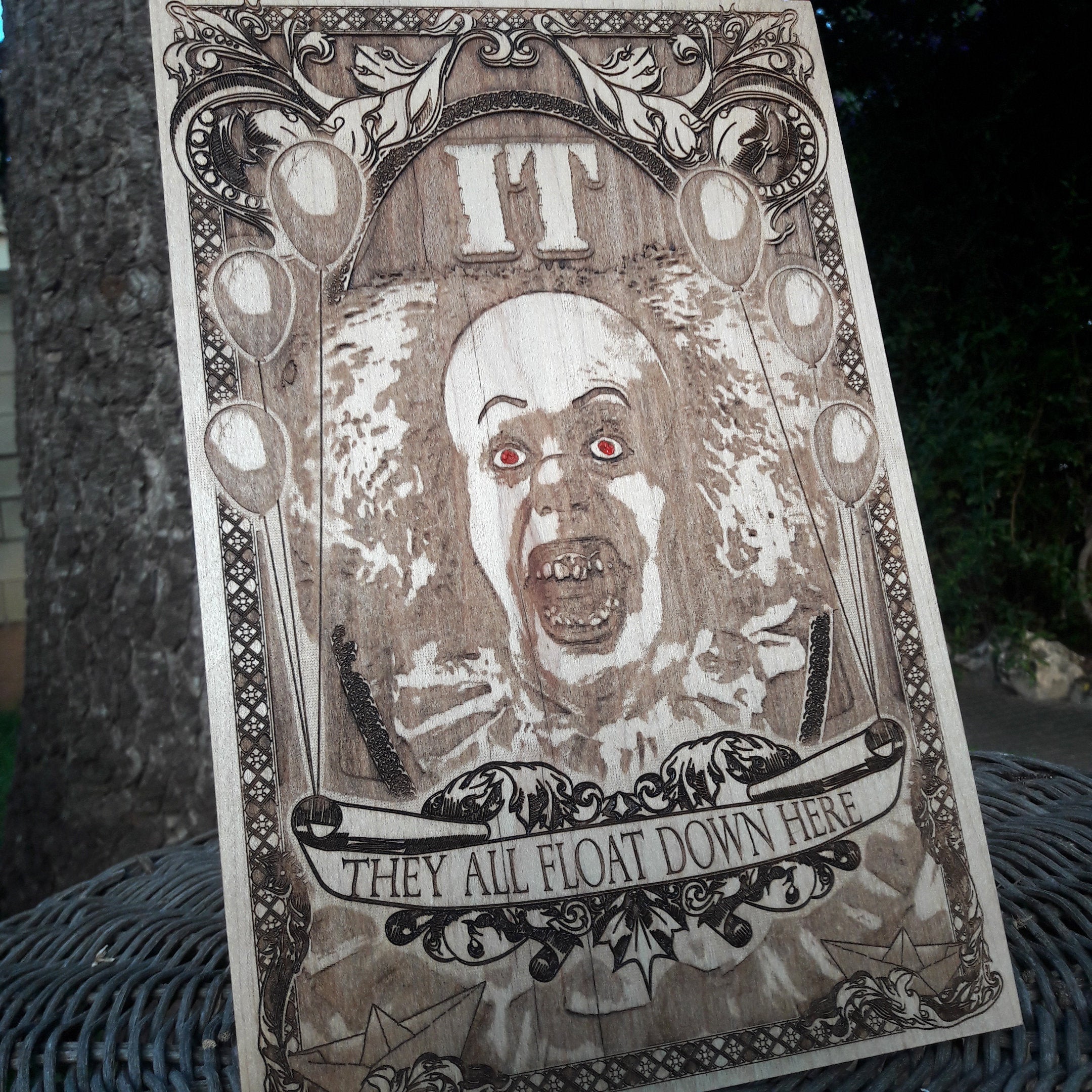 Unique wood-engraved Pennywise wall art for Stephen King fans.