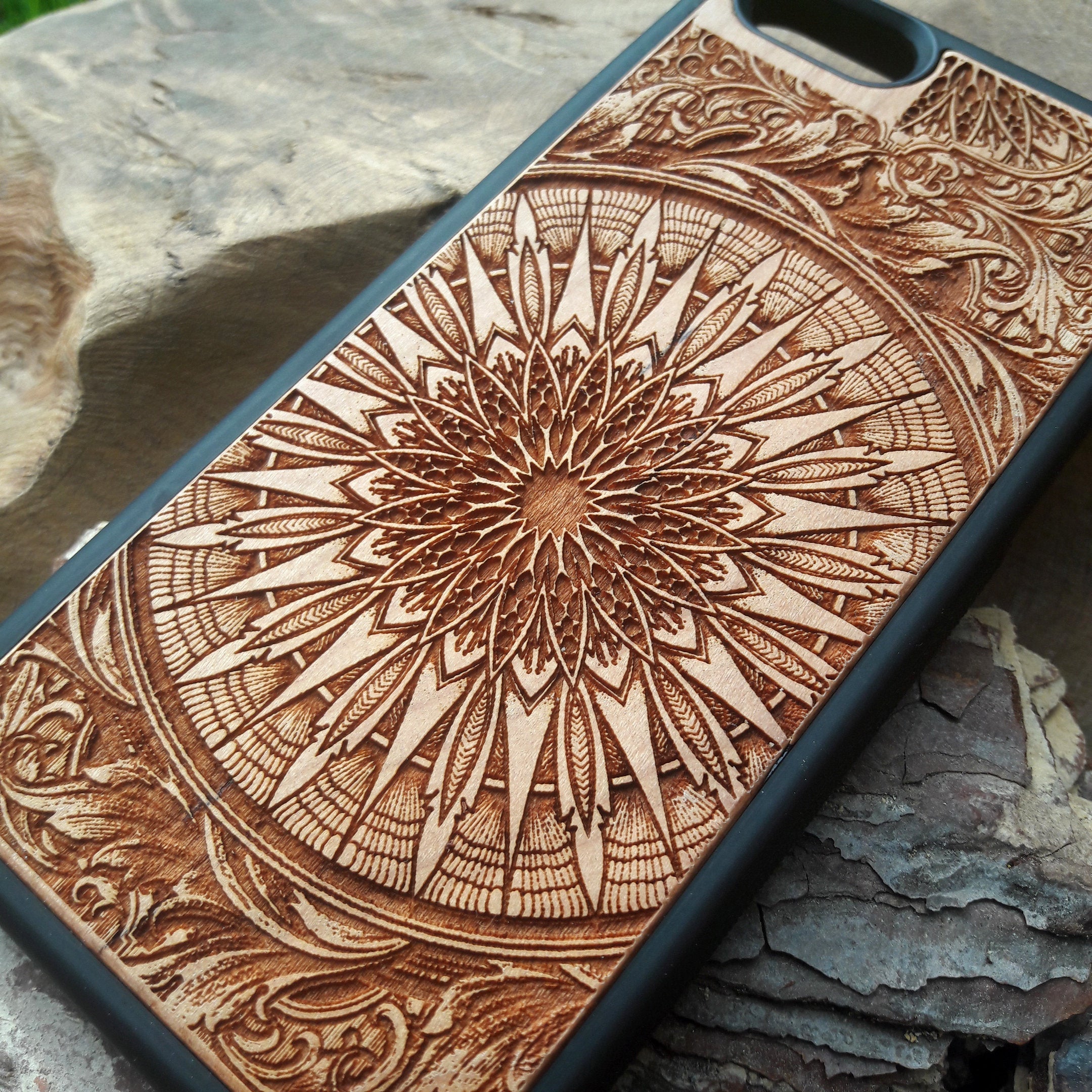 Laser-engraved wooden phone case featuring a detailed skull design, compatible with iPhone 16, iPhone 15, Galaxy S25, and more.