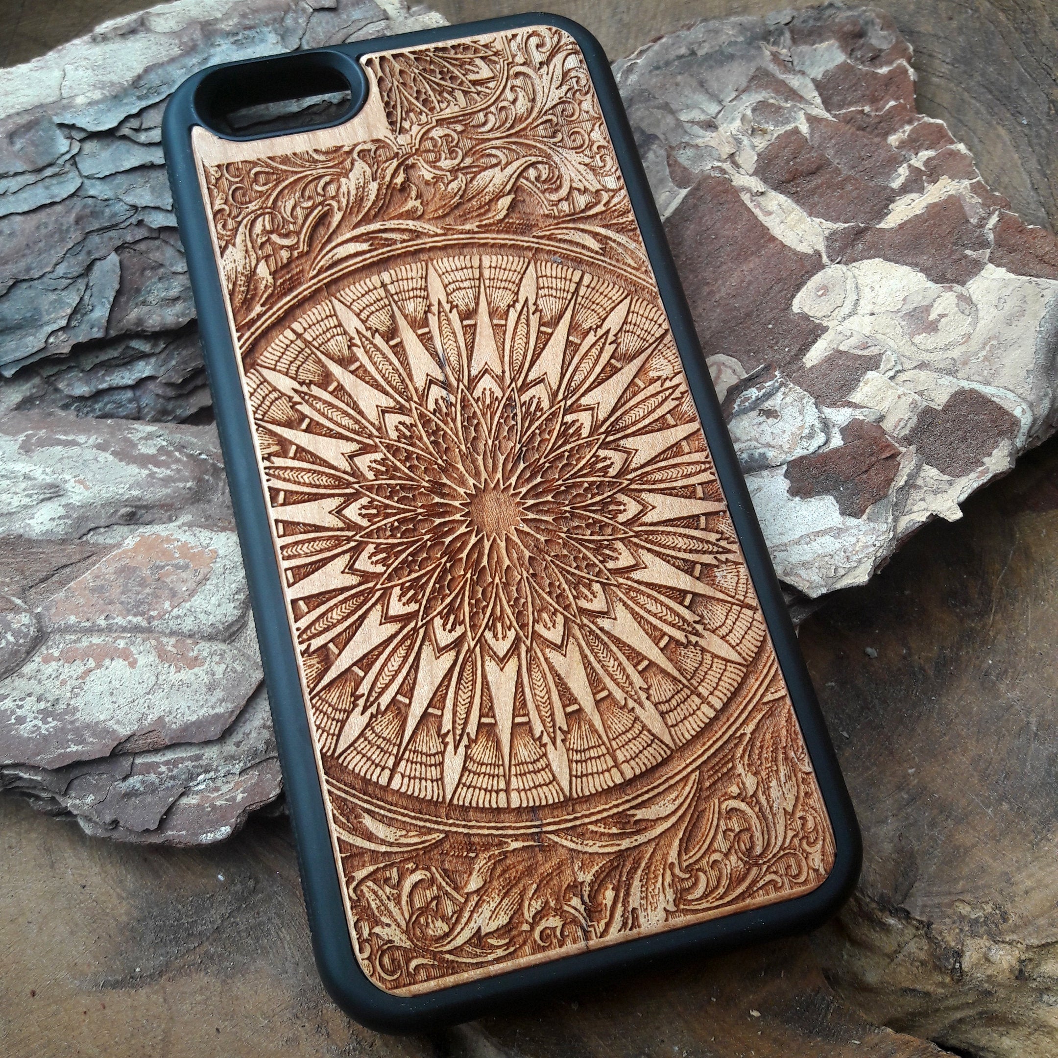 Laser-engraved wooden phone case featuring a detailed skull design, compatible with iPhone 16, iPhone 15, Galaxy S25, and more.