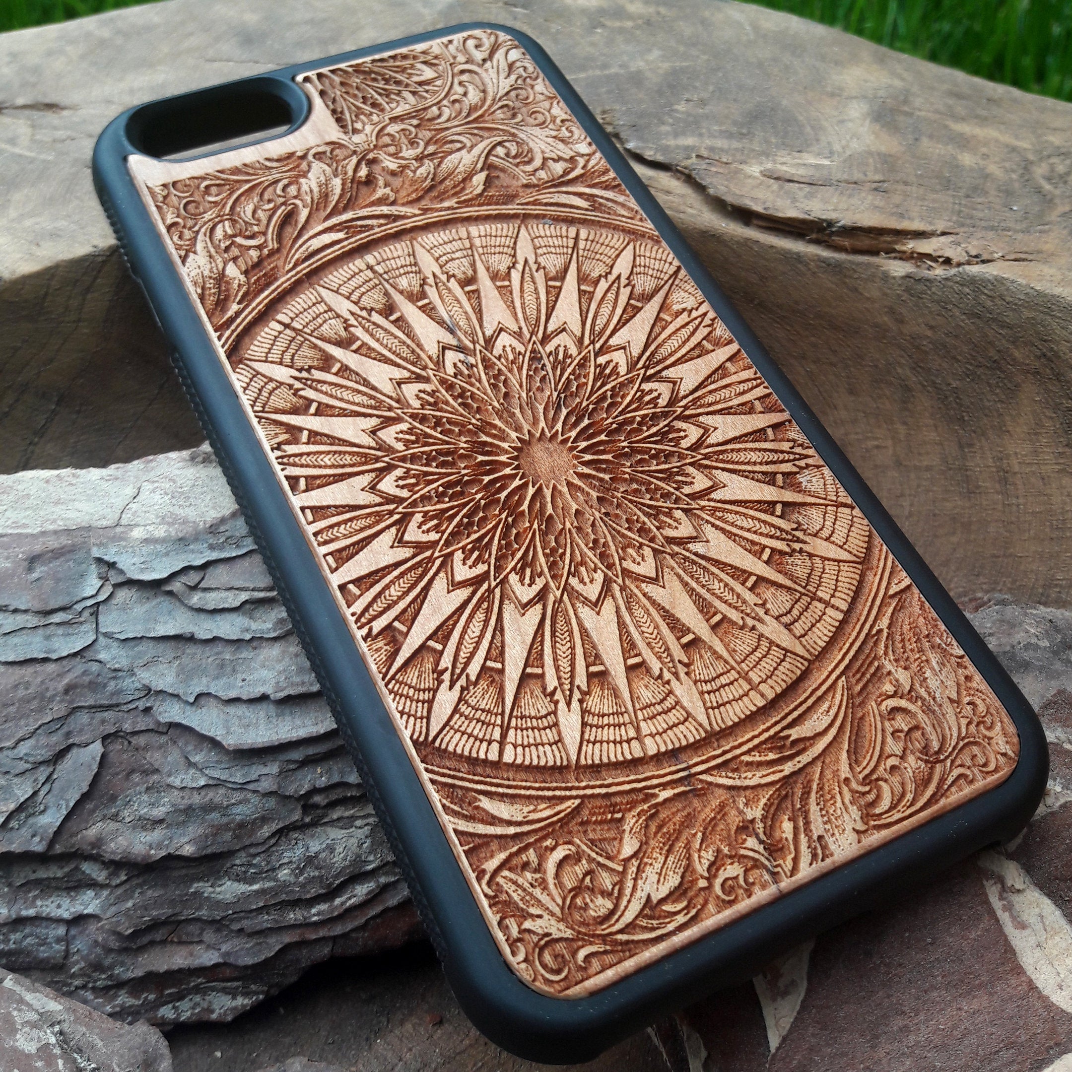 Laser-engraved wooden phone case featuring a detailed skull design, compatible with iPhone 16, iPhone 15, Galaxy S25, and more.
