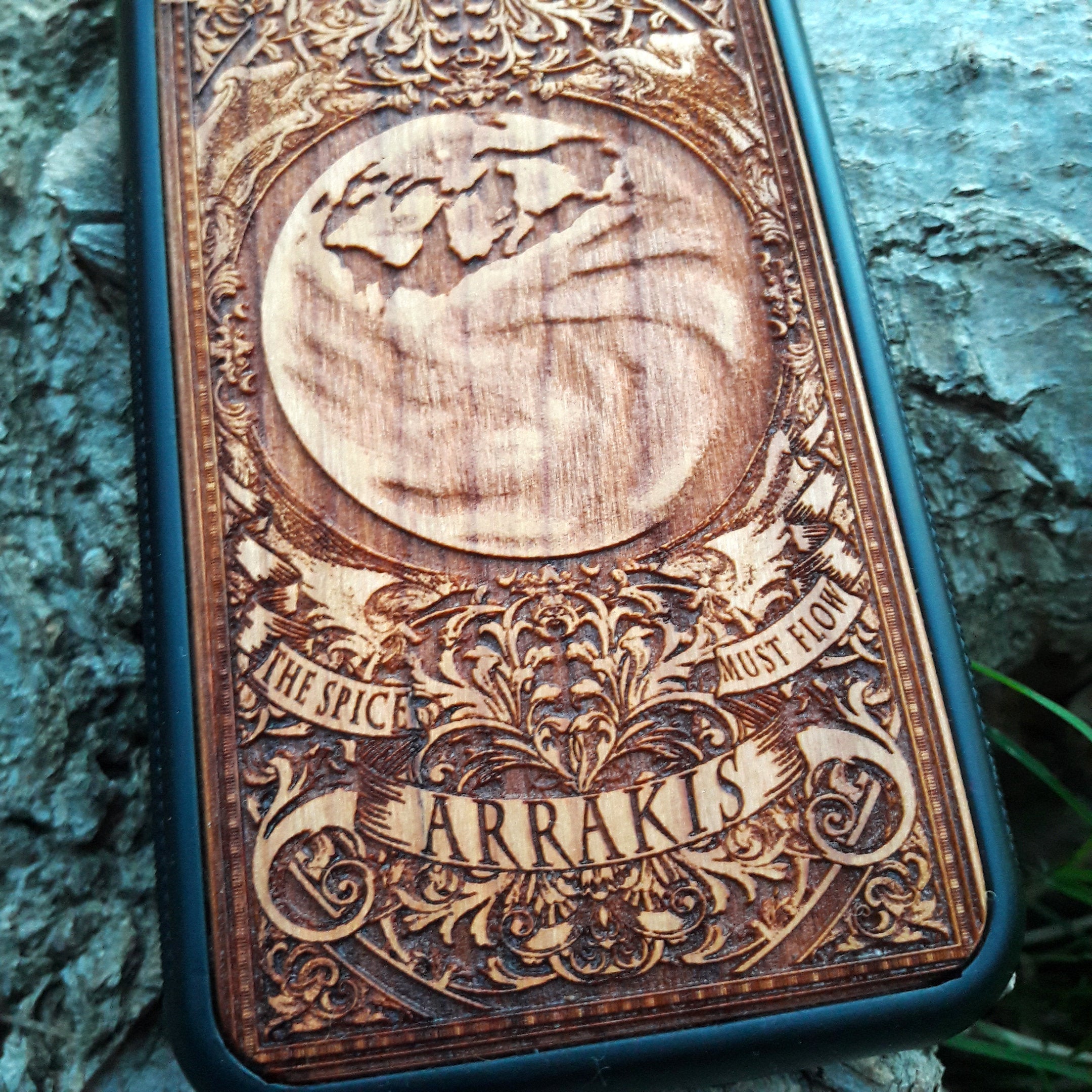 Arrakis Dune-inspired wood phone case featuring the iconic planet and "The Spice Must Flow" phrase, compatible with iPhone , 15, 14, 13, 12, 11 Pro Max Mini, Samsung Galaxy S, S24, S23, S22, S21, S20 Ultra Plus, and Note 20. Unique laser-engraved design