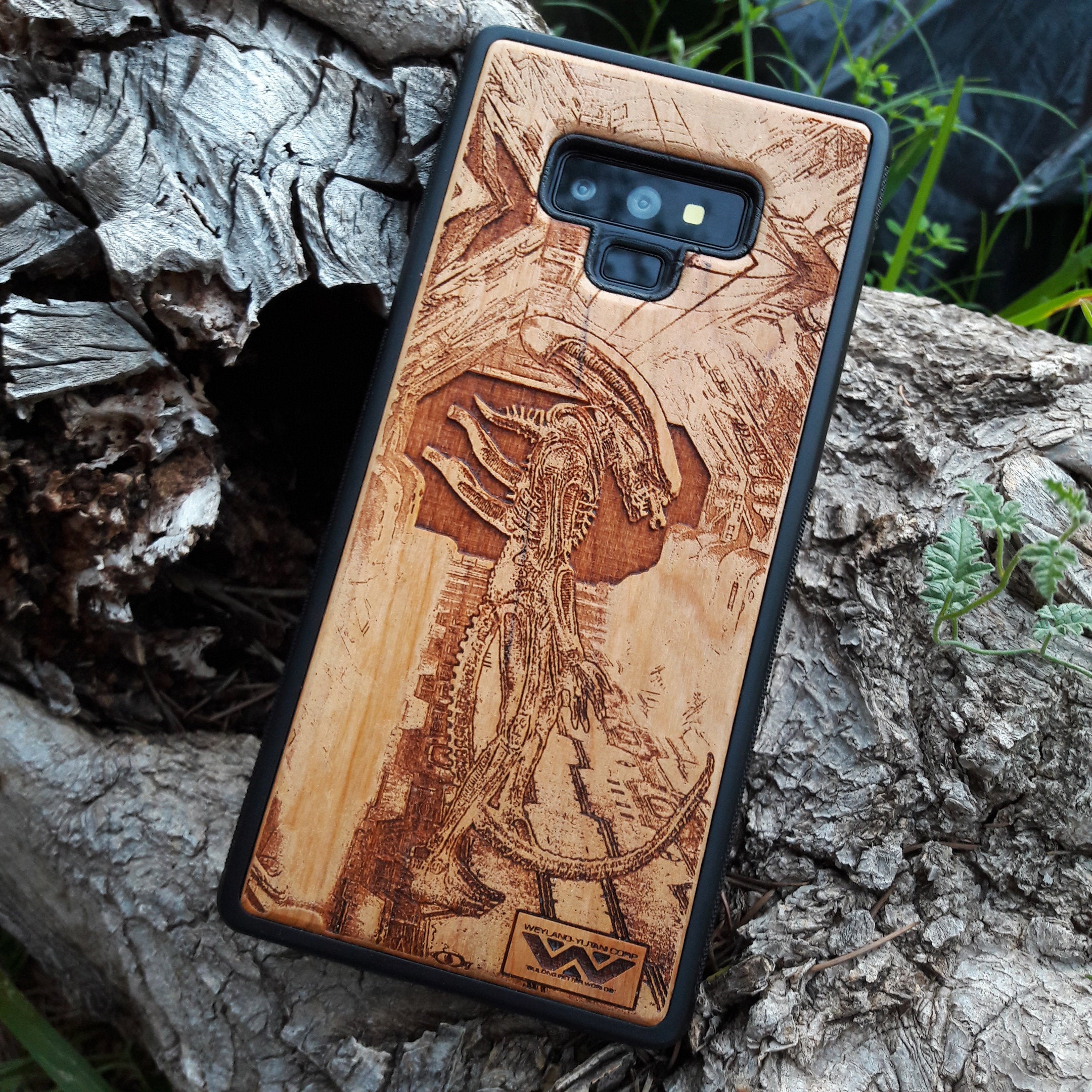 Wooden Xenomorph phone case with intricate HR Giger-inspired design, compatible with iPhone , iPhone 15, Galaxy S, and more. Perfect for Alien movie fans and sci-fi lovers.