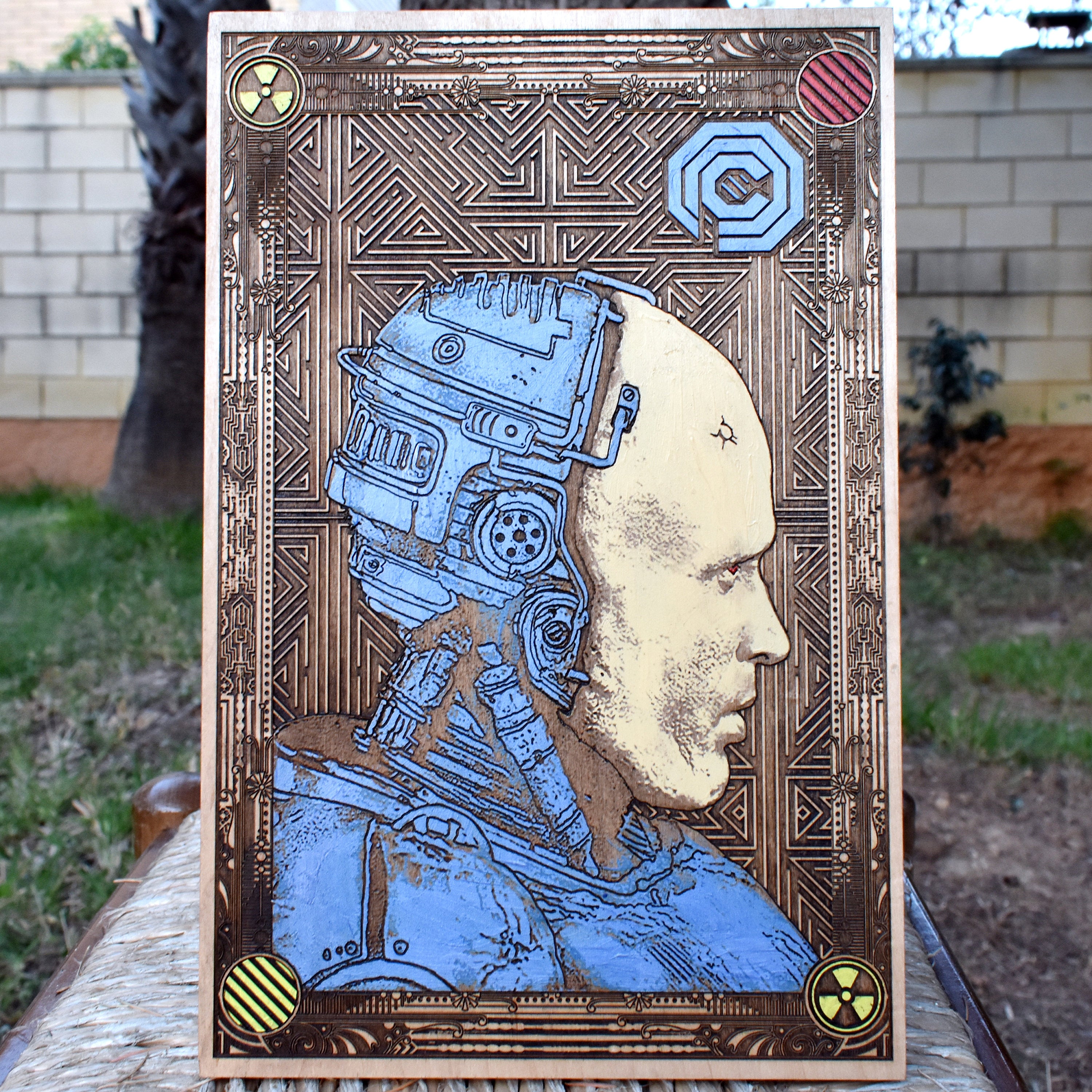 Robocop-inspired wood wall art with laser-engraved detail on cherrywood for sci-fi collectors.