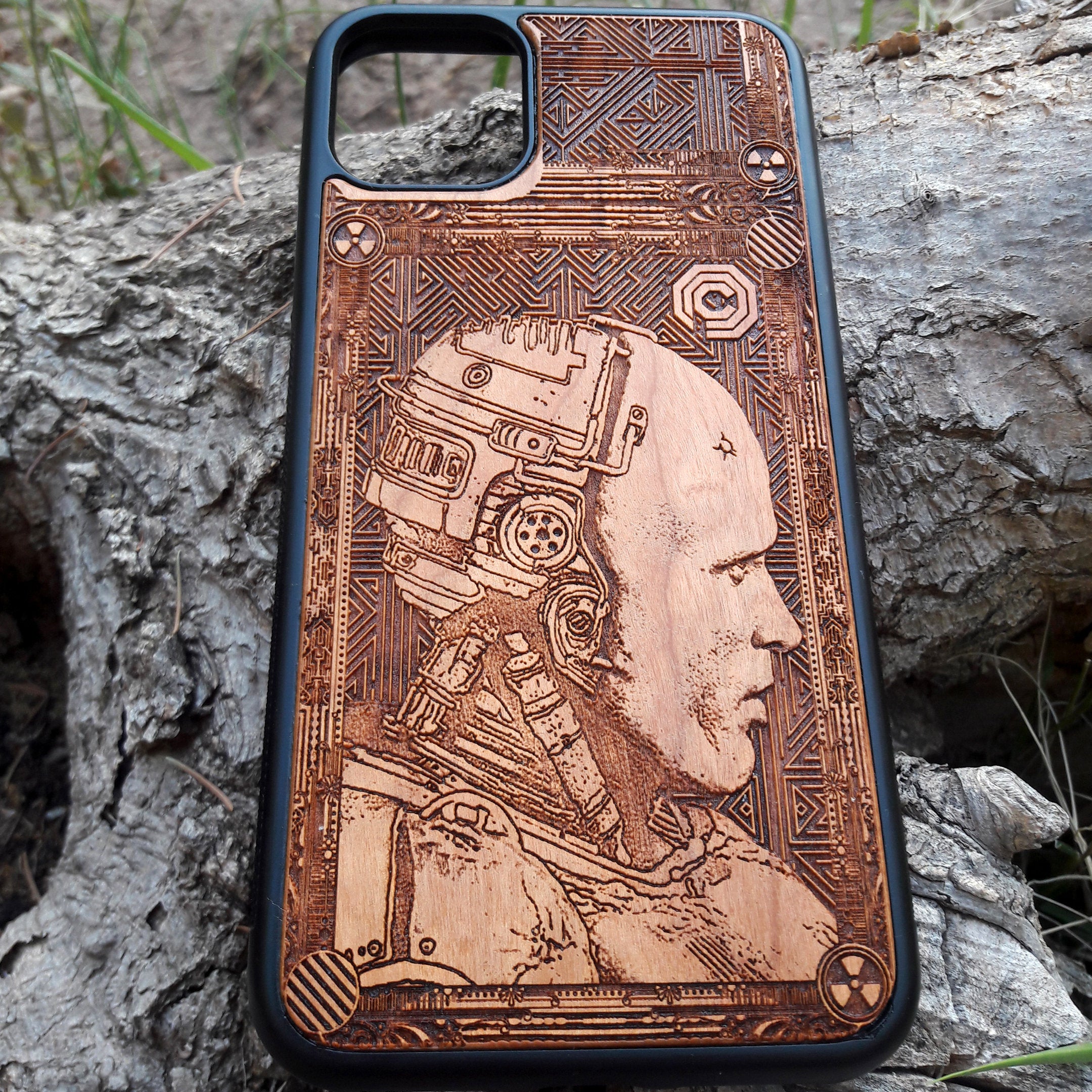 Laser-engraved Robocop wooden phone case, featuring a detailed sci-fi design, compatible with iPhone , iPhone 15, Samsung Galaxy S, Note 20, and more. Perfect for Robocop fans seeking a unique, durable phone accessory.