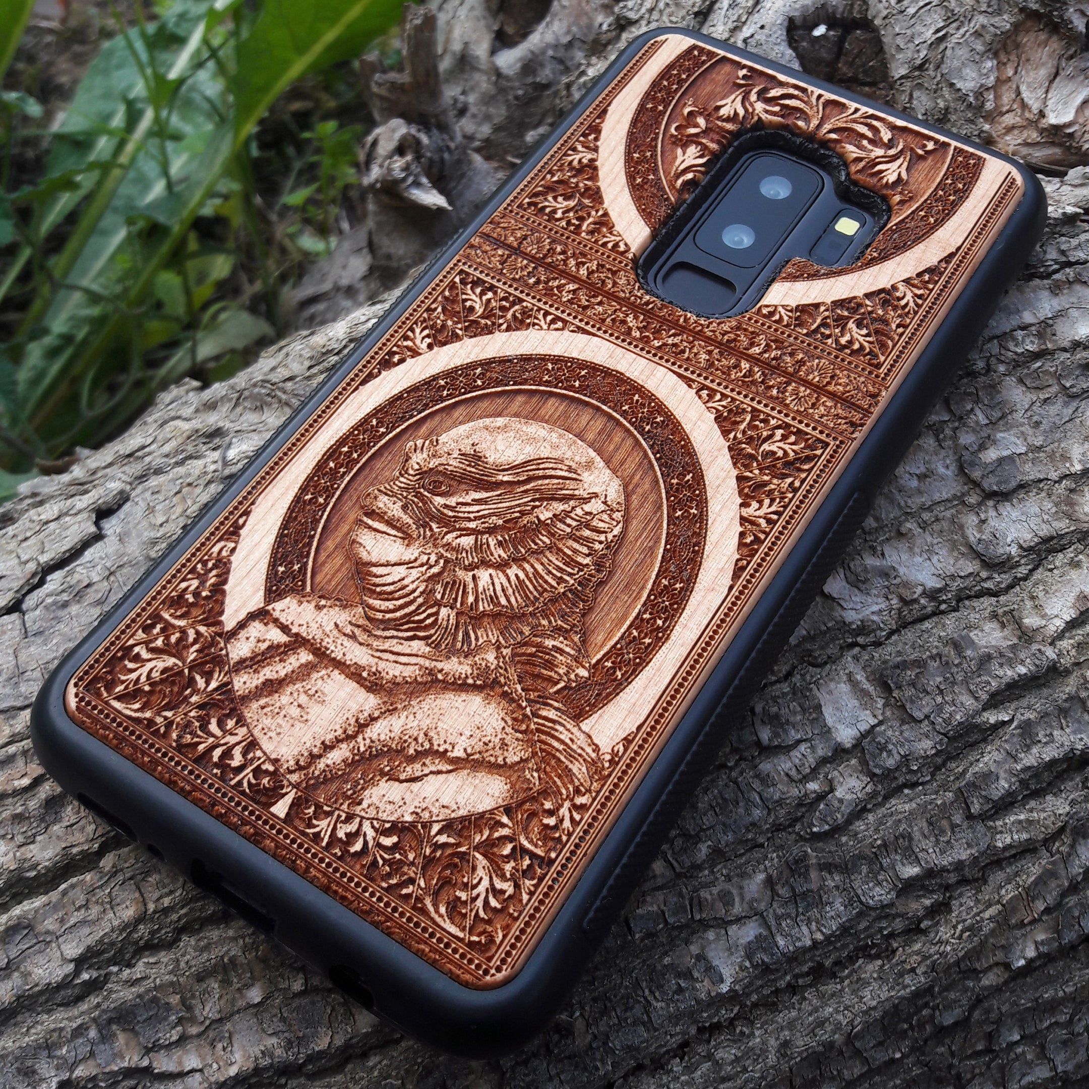 Wooden phone case with intricate carving of the Creature from the Black Lagoon design, crafted for iPhone , Samsung Galaxy S. Perfect for horror fans and collectors, offering premium protection and gothic style.