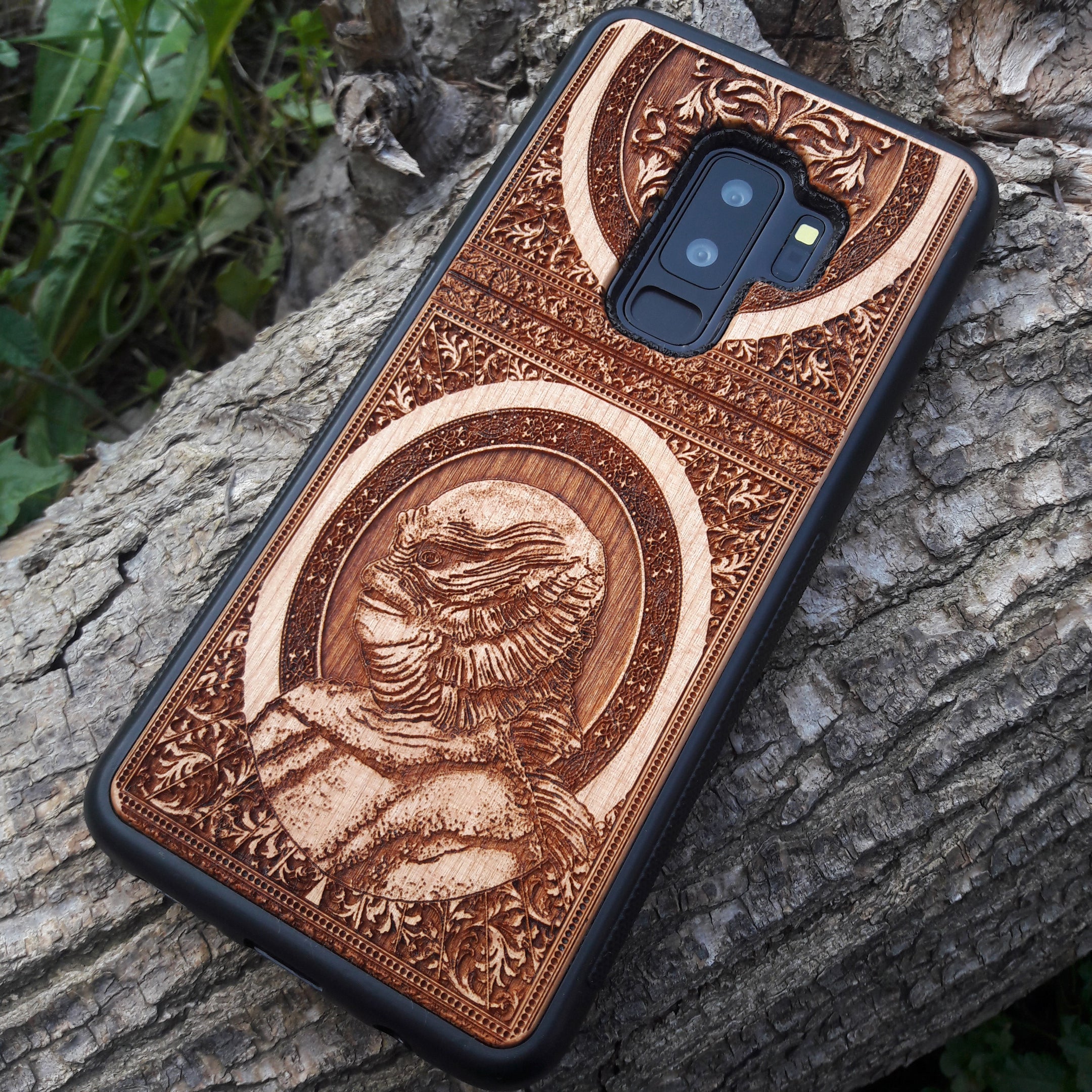 Wooden phone case with intricate carving of the Creature from the Black Lagoon design, crafted for iPhone , Samsung Galaxy S. Perfect for horror fans and collectors, offering premium protection and gothic style.