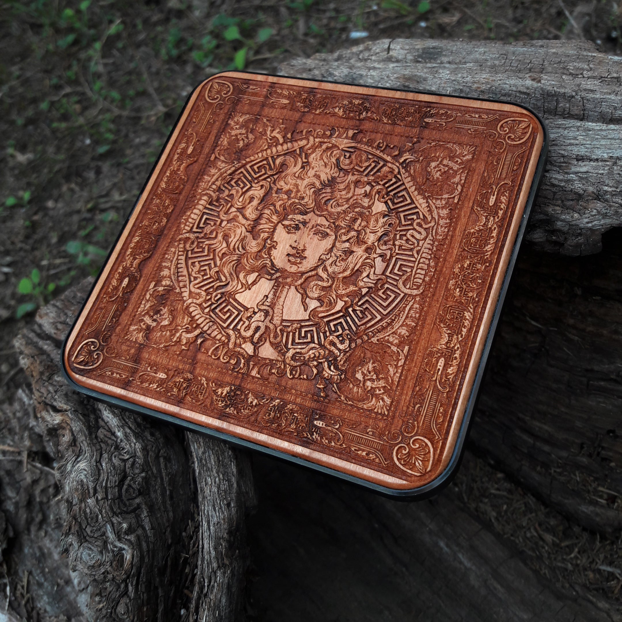 Wooden wireless charger featuring Medusa’s gaze design.