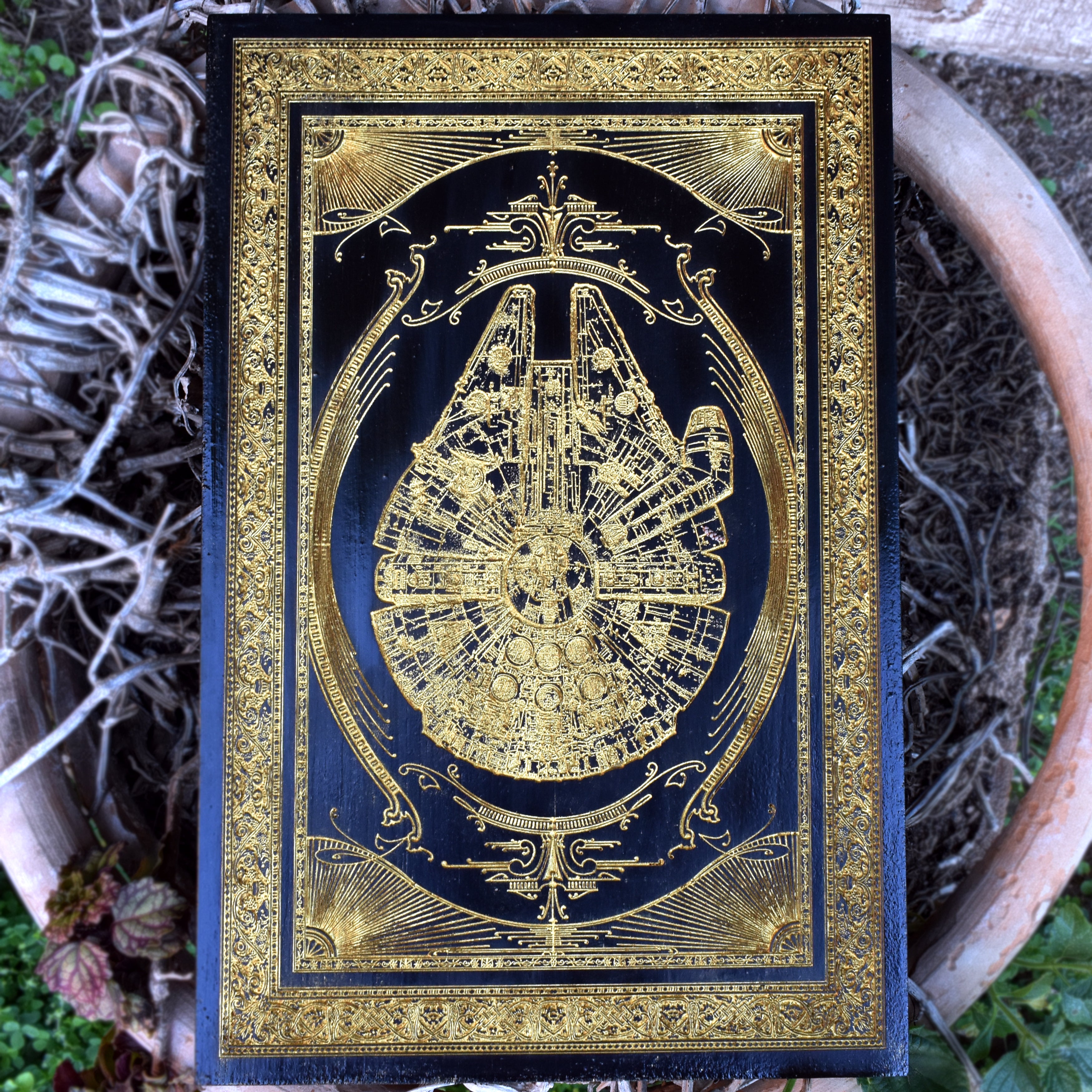 Millennium Falcon-inspired wood wall art, laser engraved with sci-fi detailing for Star Wars fans.