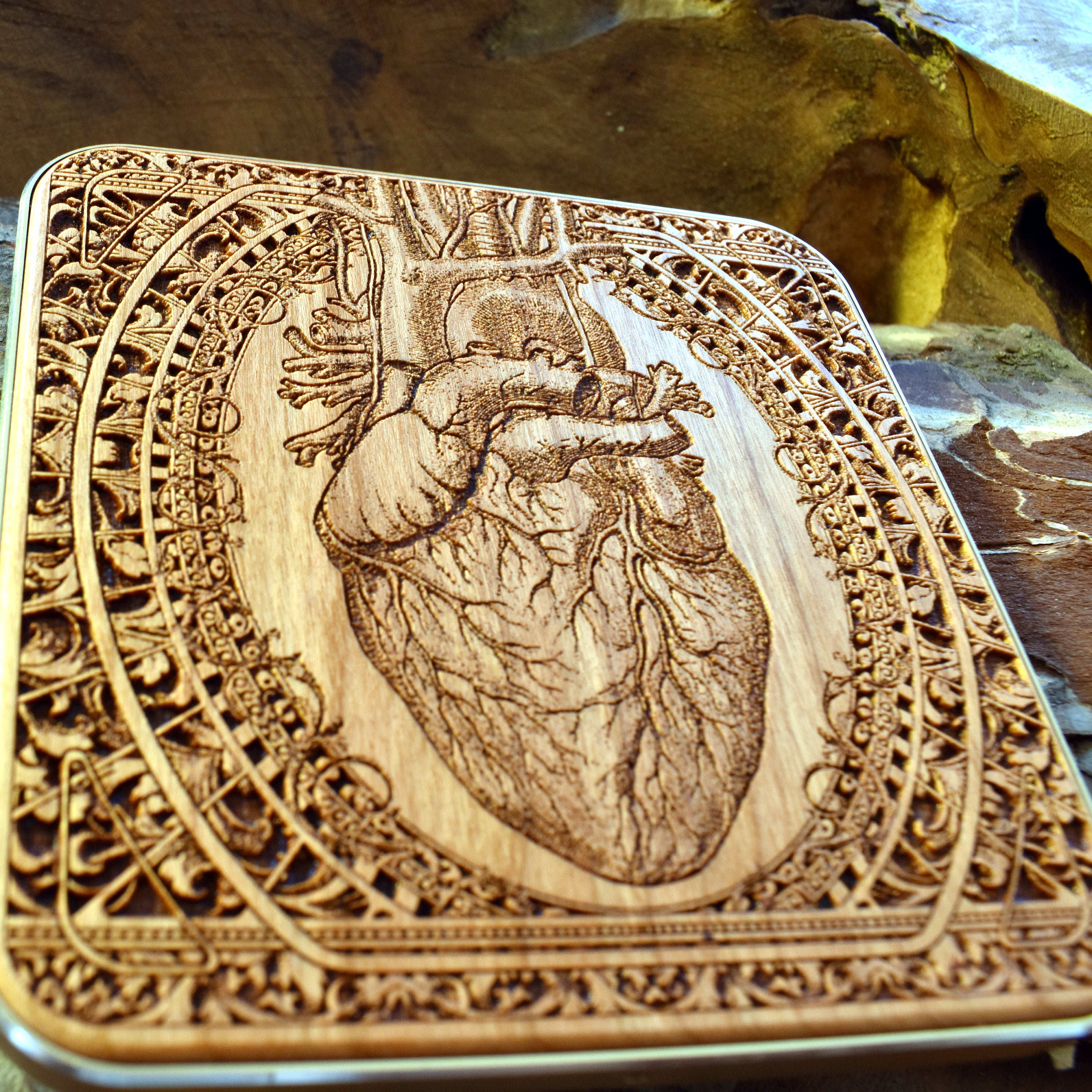Hand placing iPhone 16 on wood wireless charging station with fast charging.