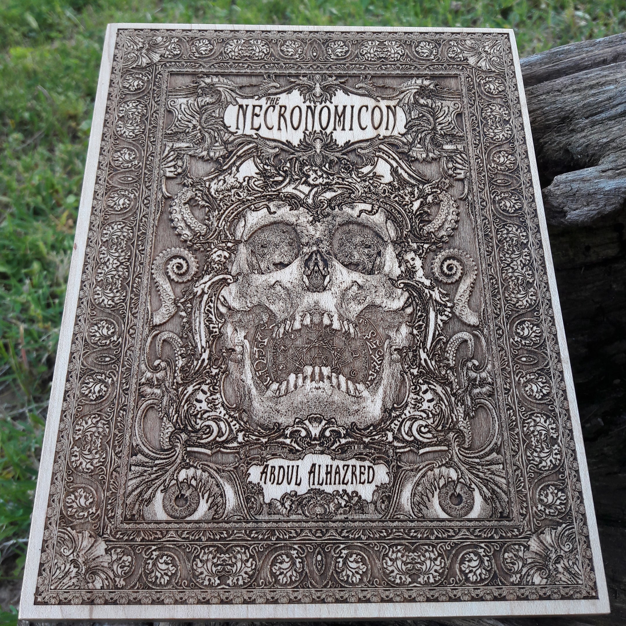 Handcrafted gothic wood artwork featuring a ram skull and occult symbols.