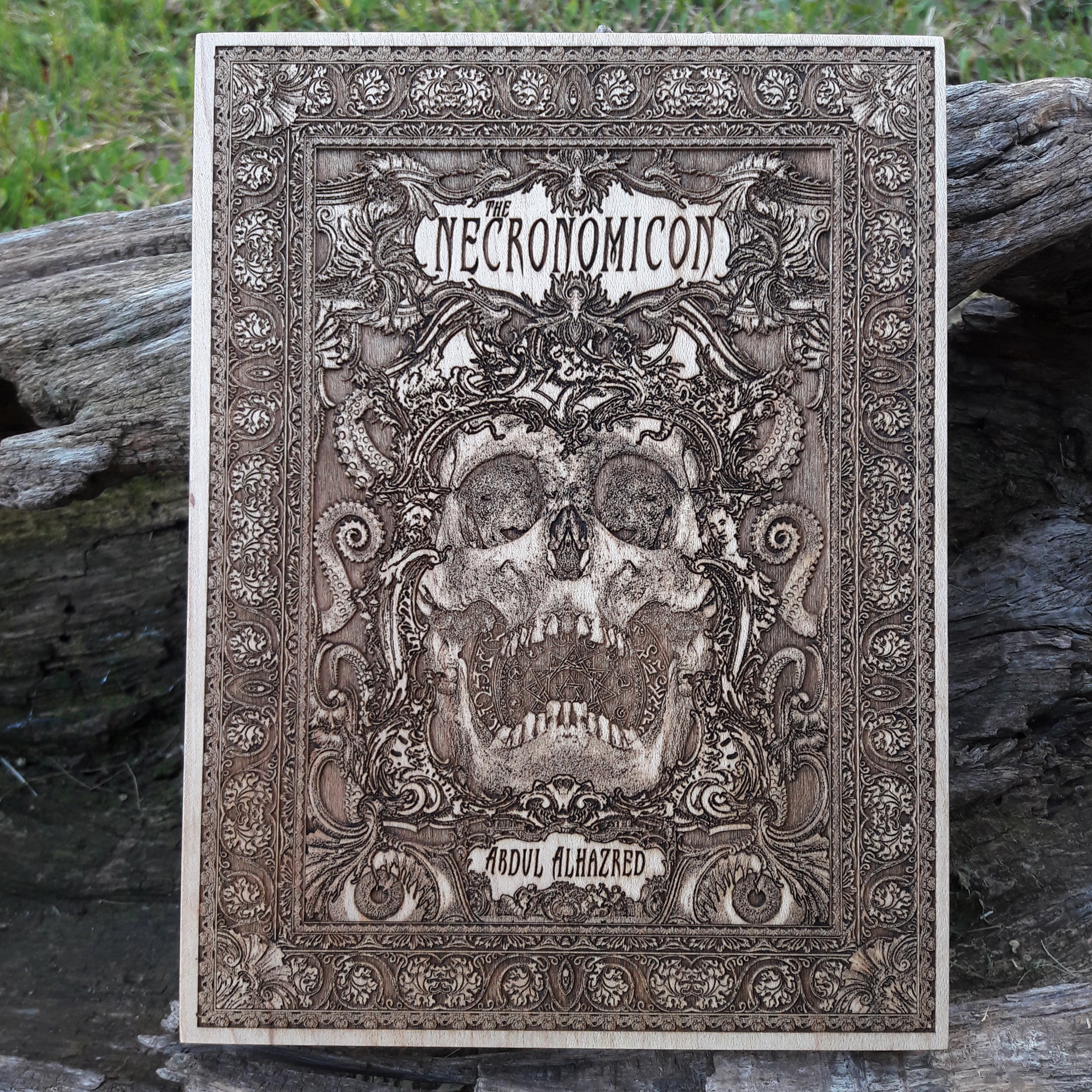 Necronomicon ram skull wood engraving – HP Lovecraft-inspired horror art.