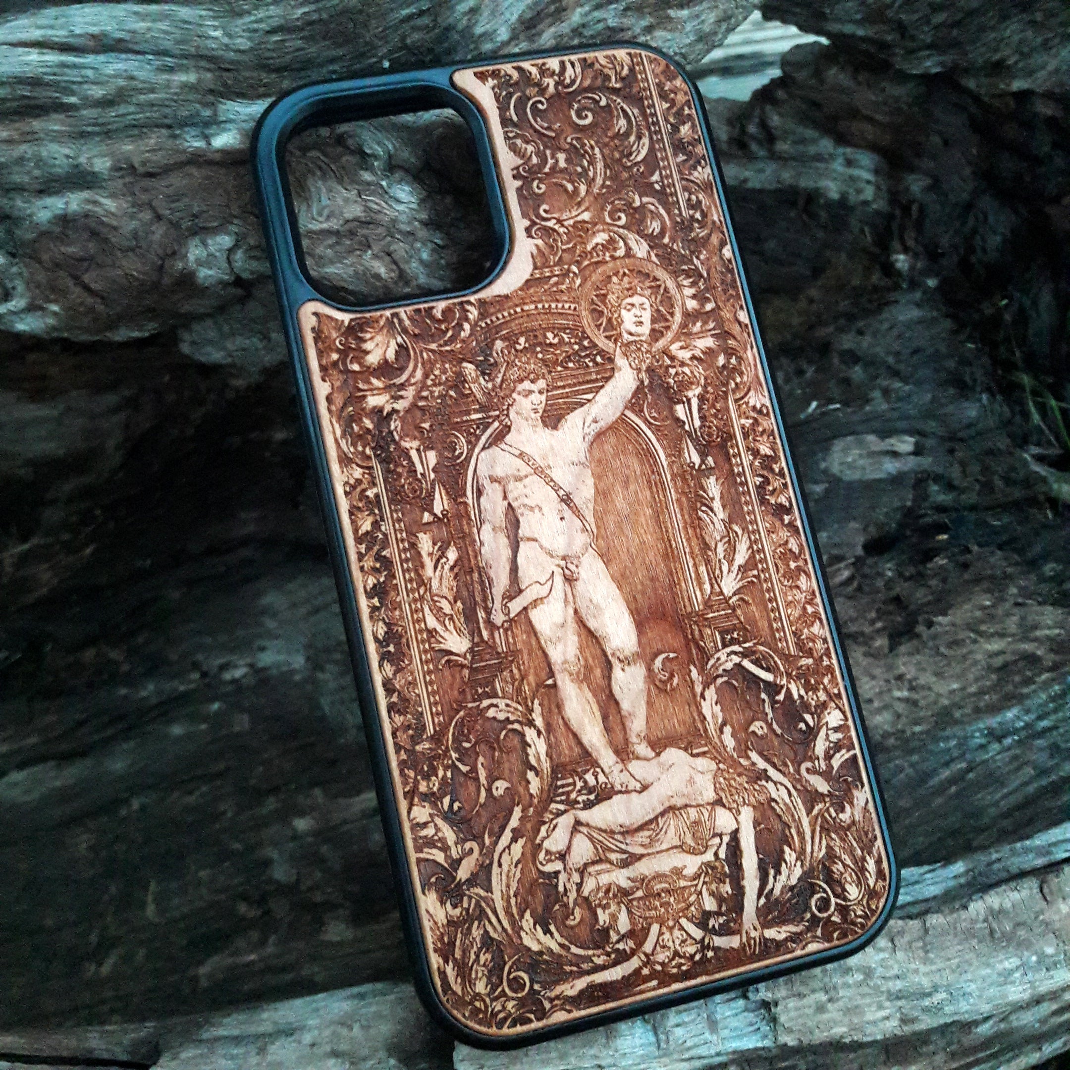 Wooden phone case featuring Perseus with the Head of Medusa, intricately carved for iPhone , iPhone 15, Samsung Galaxy S, S24, and more. Ideal for fans of mythology and gothic art, offering durable protection with a unique design.