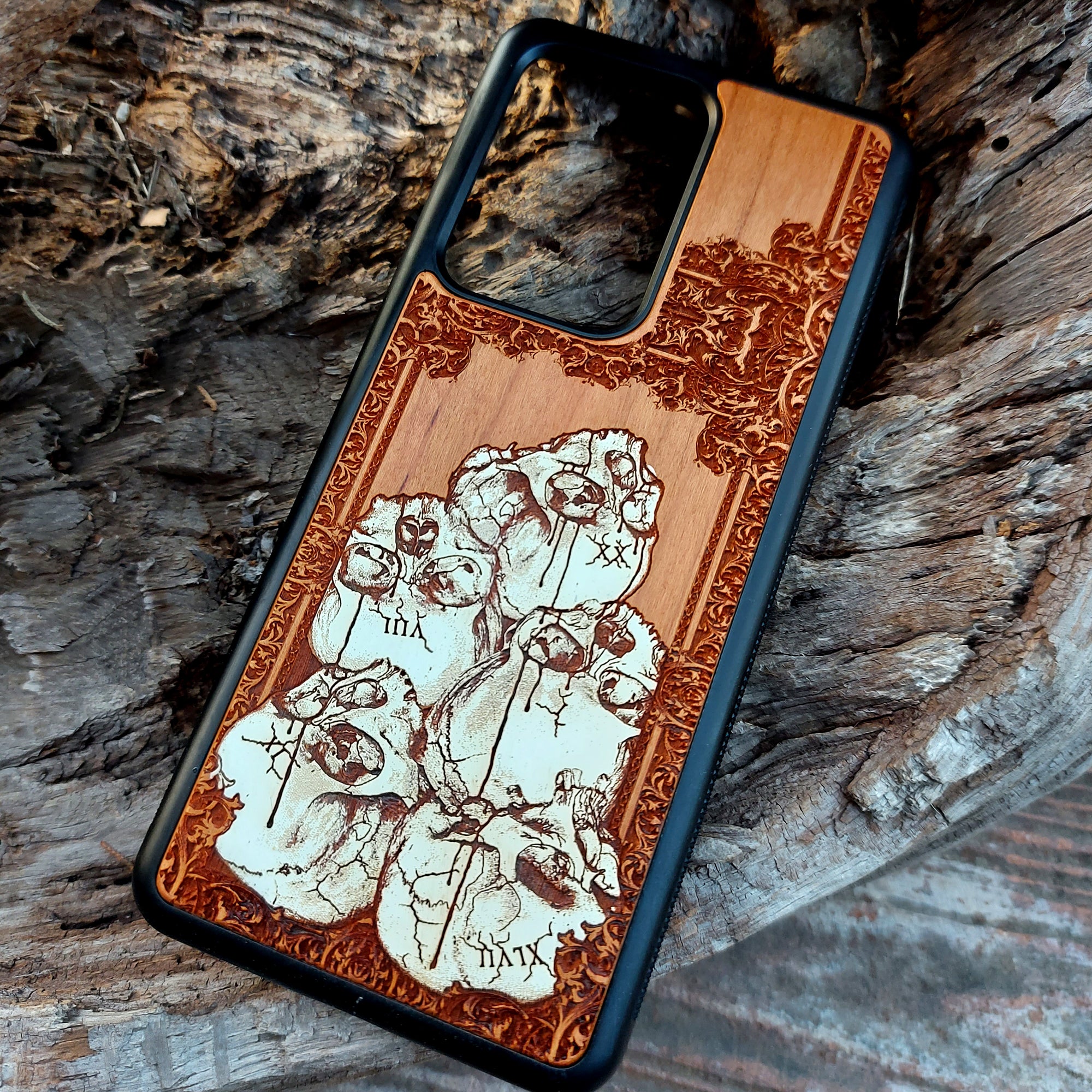 Hand-painted cherrywood phone case with laser-engraved skull pile design, compatible with iPhone -11 Pro Max and Samsung Galaxy S-S20 models.