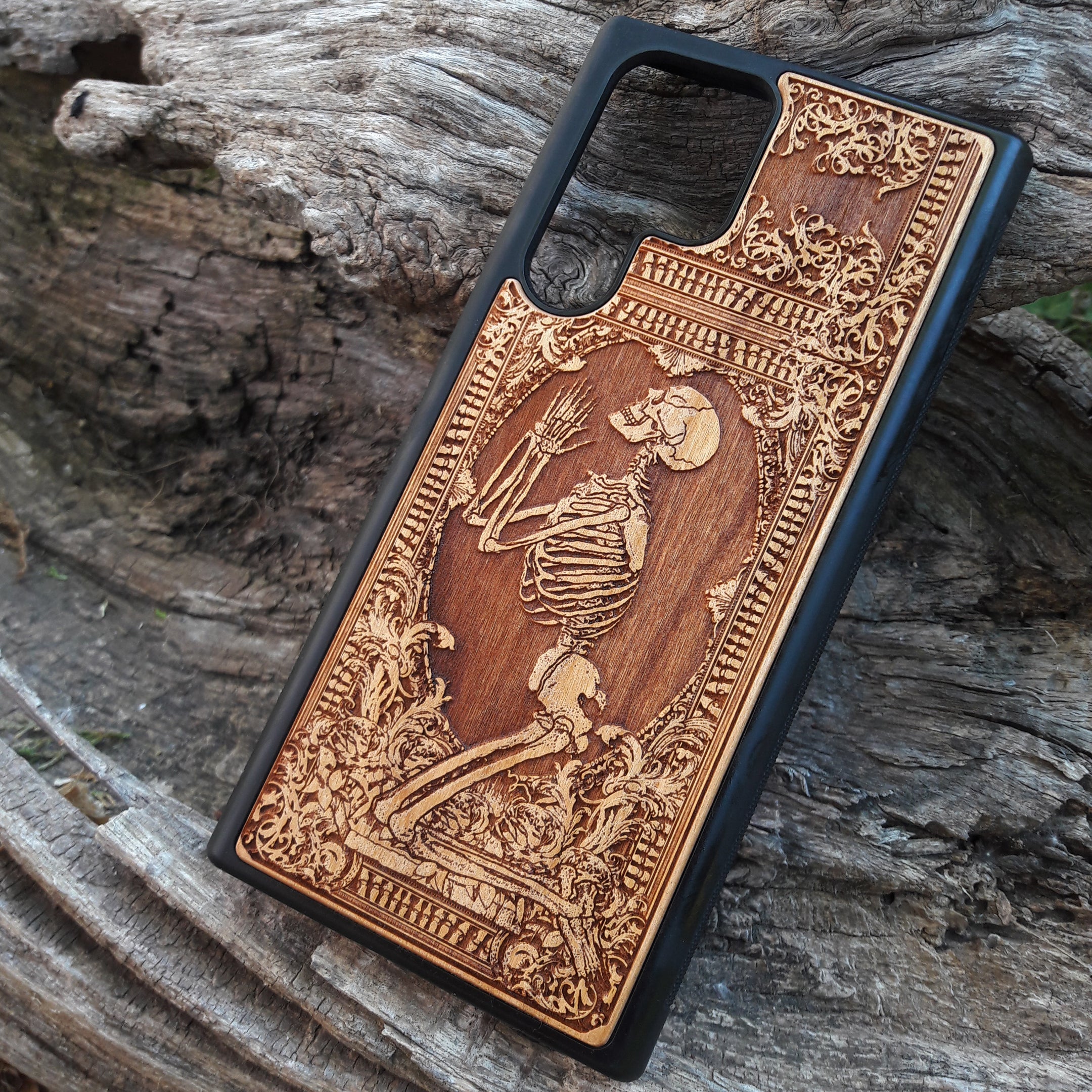 Shop our premium wooden phone cases designed for iPhone , iPhone 15, Galaxy S23, S22, Note 20, and more. Featuring intricate designs like the praying skeleton, it’s the perfect personalized gift for tech enthusiasts. Available for multiple iPhone and Galaxy models, these cases offer durable protection with style.