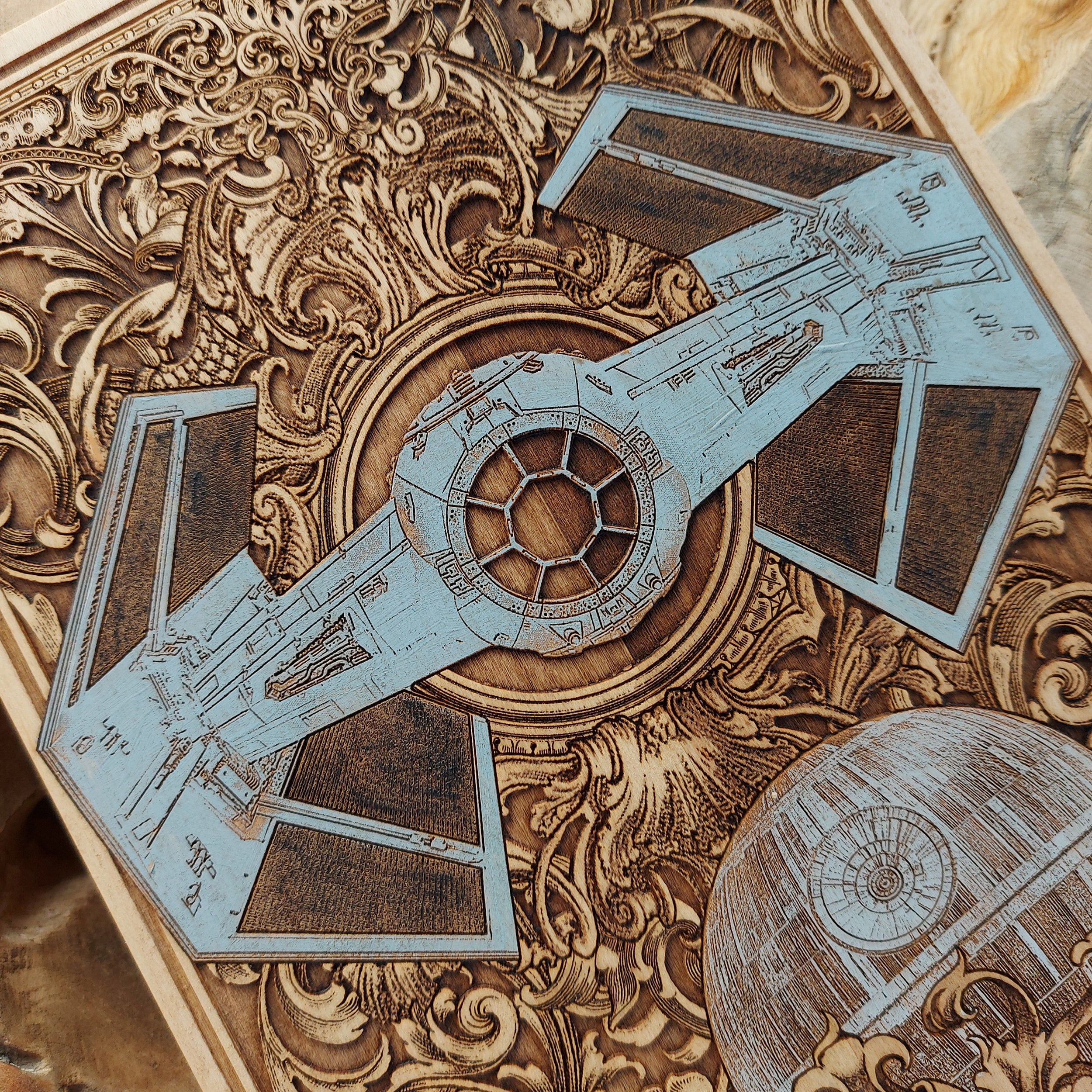 Handcrafted wood art with laser-engraved Vader TIE Fighter from Star Wars.