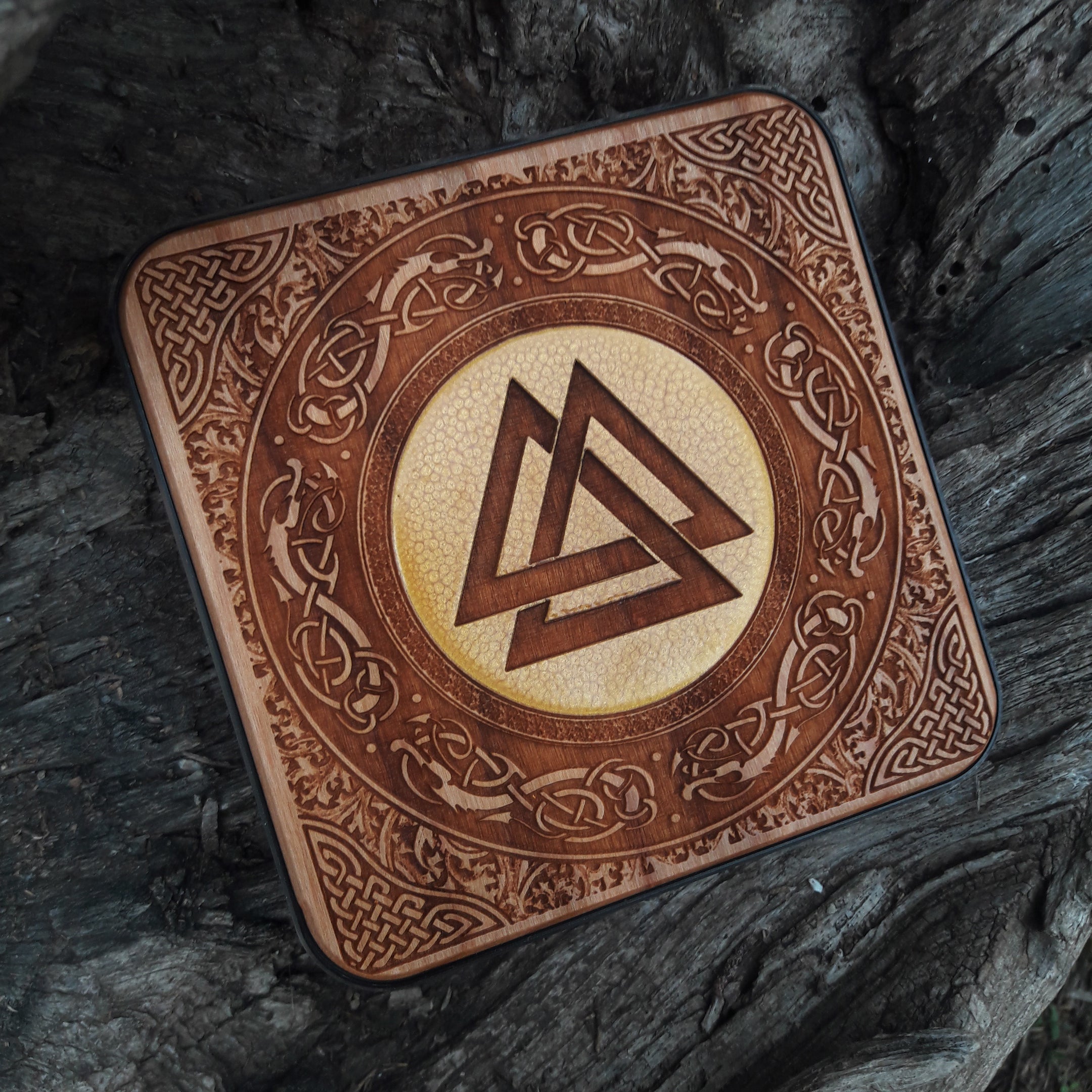 Overhead view of Norse symbols on Viking wireless charger.