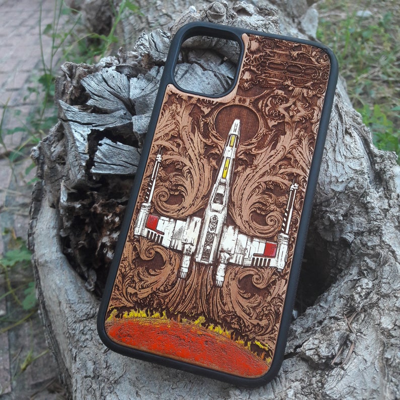 X-Wing Star Wars wooden phone case, hand-painted and laser-engraved on cherrywood. Compatible with iPhone 16, Galaxy S25, and more. Sci-fi inspired phone case.