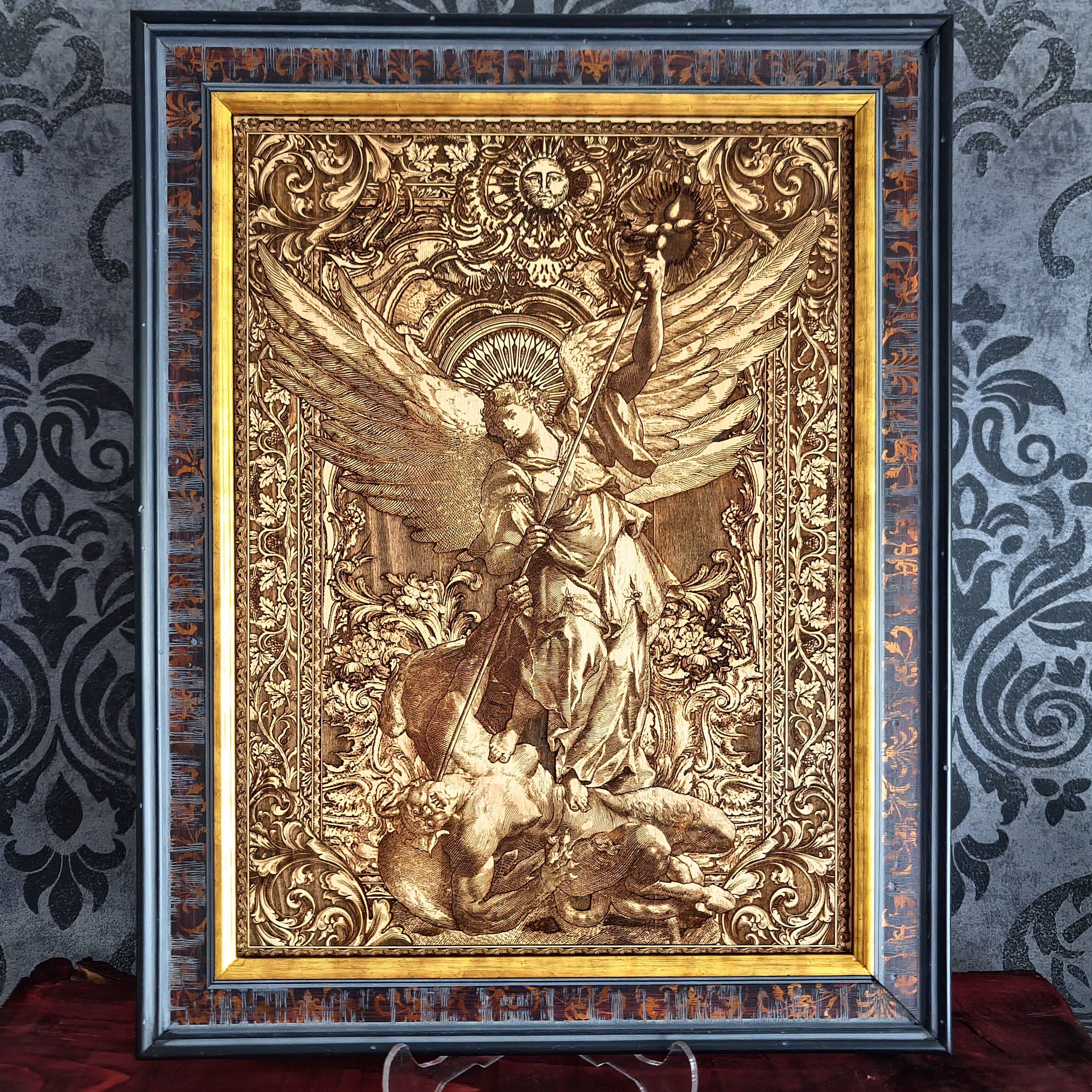 Archangel Michael defeating Satan laser engraved on wood with hand-painted details, antique gold finish, Gothic cathedral background, handmade Christian wall art.