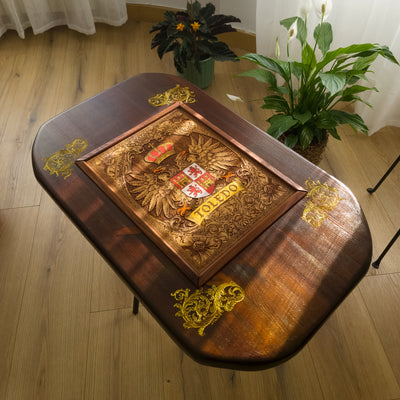 Handmade walnut stained wood coffee table with engraved hand-painted Toledo family crest cedar inlay