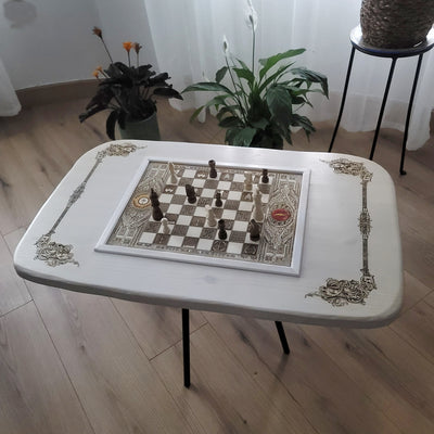 Handmade white-stained chessboard table top with LOTR engraving on maple and douglas fir wood, elegant carved corners, and artisan finish.