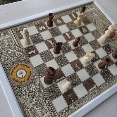 Handmade white-stained chessboard table top with LOTR engraving on maple and douglas fir wood, elegant carved corners, and artisan finish.
