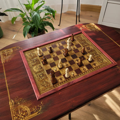 Handmade wooden chessboard coffee table with Roman laser engraving, pine and maple wood, gold details, red walnut finish.