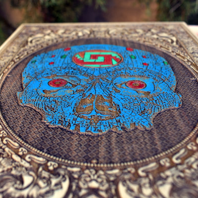 Tribal Aztec skull art wall hanging, engraved and painted on wood.