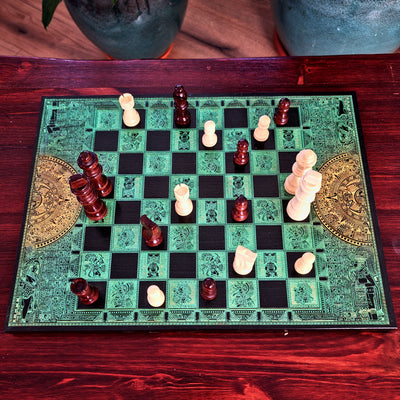 green and black wood chessboard laser engraved with mayan symbols and aztec calendar