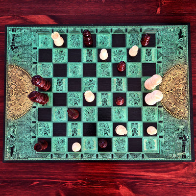green and black wood chessboard laser engraved with mayan symbols and aztec calendar