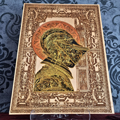 Black-and-gold medieval knight helmet maple wood wall art, unframed front view with ornate architectural border