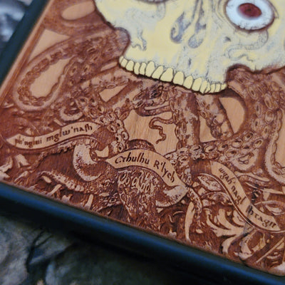 Cthulhu-inspired gothic artwork engraved on a wooden phone case, compatible with iPhone  and Samsung Galaxy