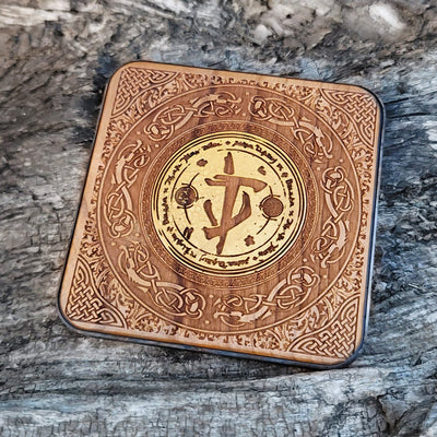 Overhead view of Doom game symbol painted on wood charger.