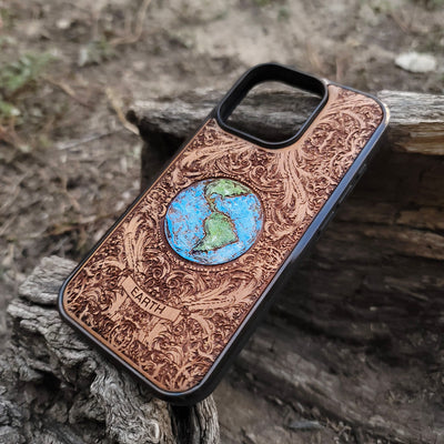 Laser-engraved Earth design on a wooden phone case, compatible with iPhone 16, iPhone 15, Galaxy S25, and more.