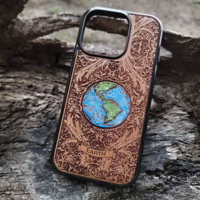 Laser-engraved Earth design on a wooden phone case, compatible with iPhone 16, iPhone 15, Galaxy S25, and more.