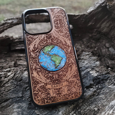 Laser-engraved Earth design on a wooden phone case, compatible with iPhone 16, iPhone 15, Galaxy S25, and more.