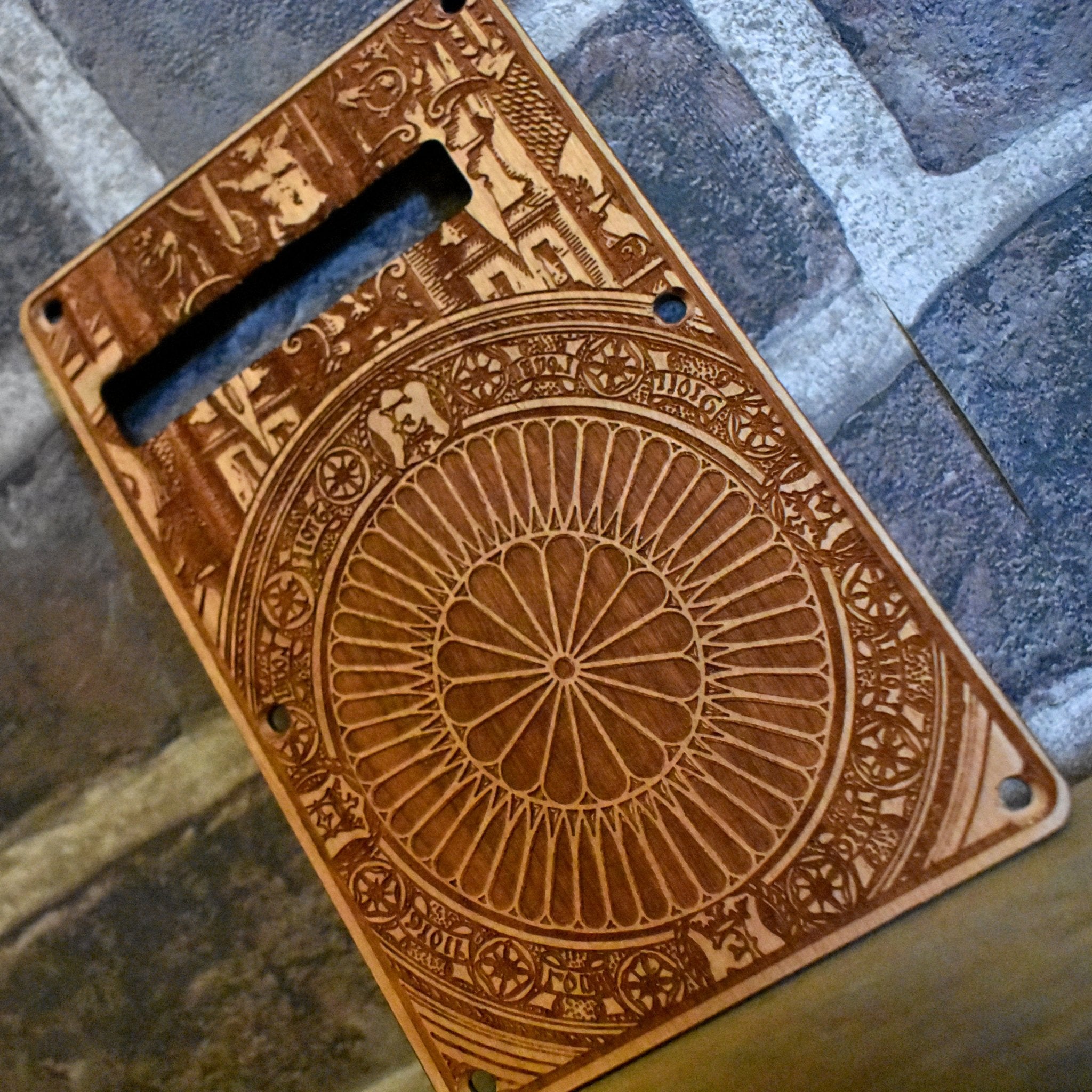 Hand-finished cherry wood tremolo cover with detailed laser engraving, designed for Fender Stratocaster.