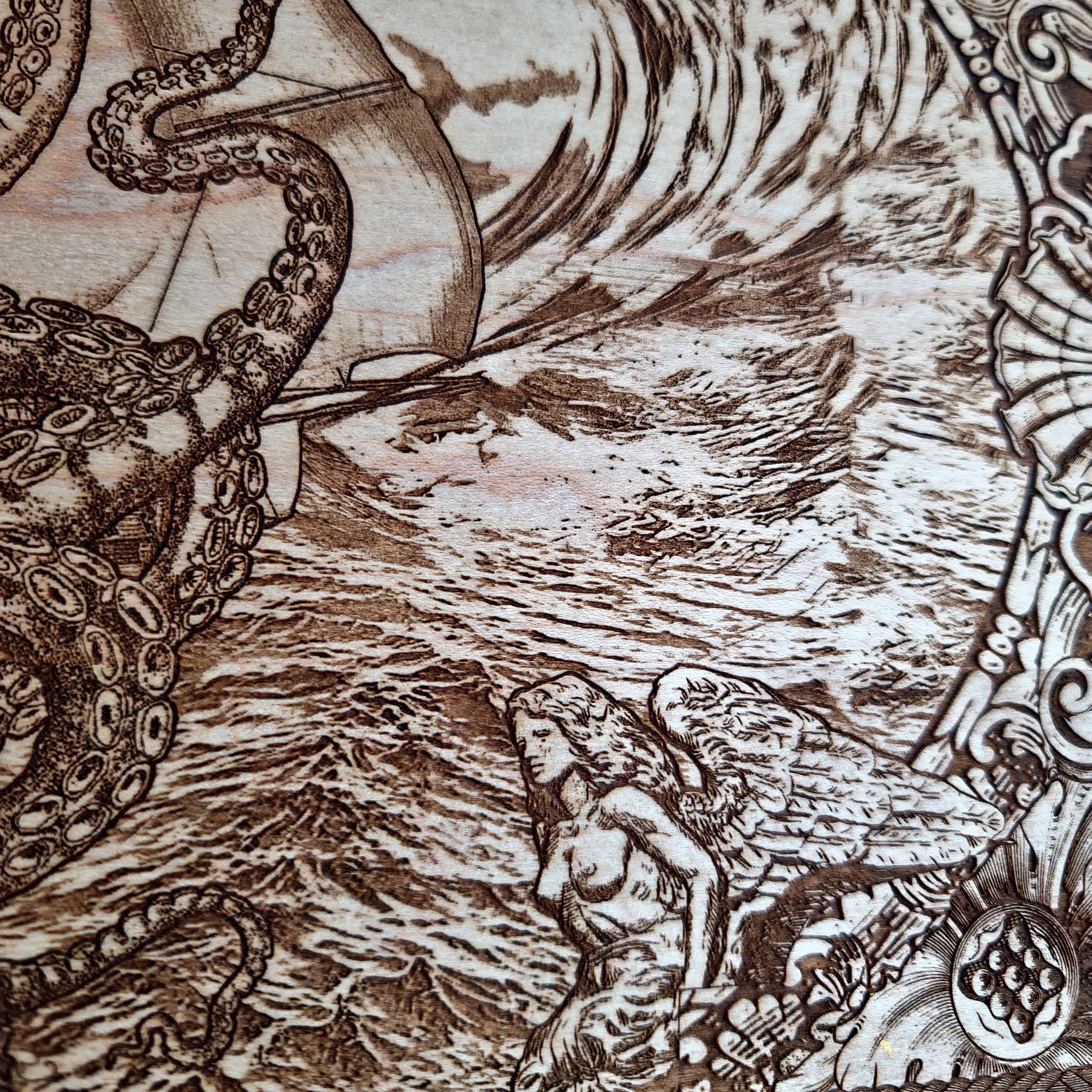 Extra-large Kraken engraved wood wall art, close-up of the sailor figure and laser-engraved ocean