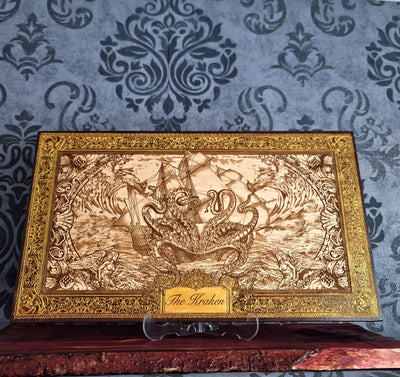 Extra-large Kraken engraved wood wall art, wide front view of the Kraken artwork on a clear stand