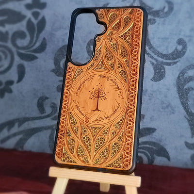 Lord of the Rings wood phone case featuring the White Tree of Gondor surrounded by Elvish script and intricate, detailed patterns.