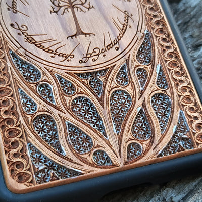 Lord of the Rings Gothic Design IV Silver wood phone case featuring intricate laser-engraved Gothic patterns. Compatible with iPhone , 15, 14, 13, 12, 11 Pro Max Mini, and Samsung Galaxy S, S24, S23, S22, S21, S20 Ultra Plus, Note 20. A unique and protective accessory for fans of the Lord of the Rings series.