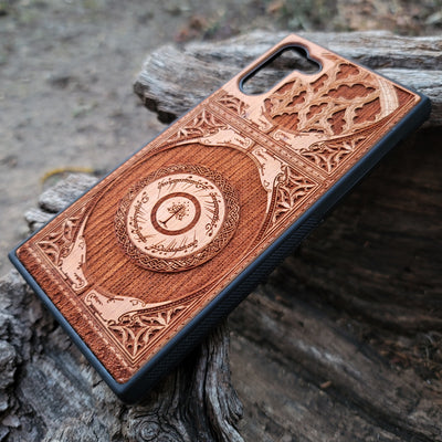 Wooden phone case featuring a gothic Lord of the Rings-inspired design with intricate engravings of the iconic White Tree of Gondor and Elvish script. The laser-engraved details capture the elegance and mystique of Tolkien’s world, perfect for fans of Middle-earth. Compatible with iPhone , 15, 14, 13, 12, 11 Pro Max Mini, and Samsung Galaxy S, S24, S23, S22, S21, S20 Ultra, Plus, Note 20. A unique, durable, and stylish accessory for LOTR enthusiasts.