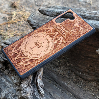 Gothic design wood phone case featuring intricate laser-engraved patterns inspired by Lord of the Rings. Compatible with iPhone , iPhone 15, 14, 13, 12, 11 Pro Max Mini, and Samsung Galaxy S, S24, S23, S22, S21, S20 Ultra, Plus, Note 20. Durable, slim, and stylish for Tolkien fans.